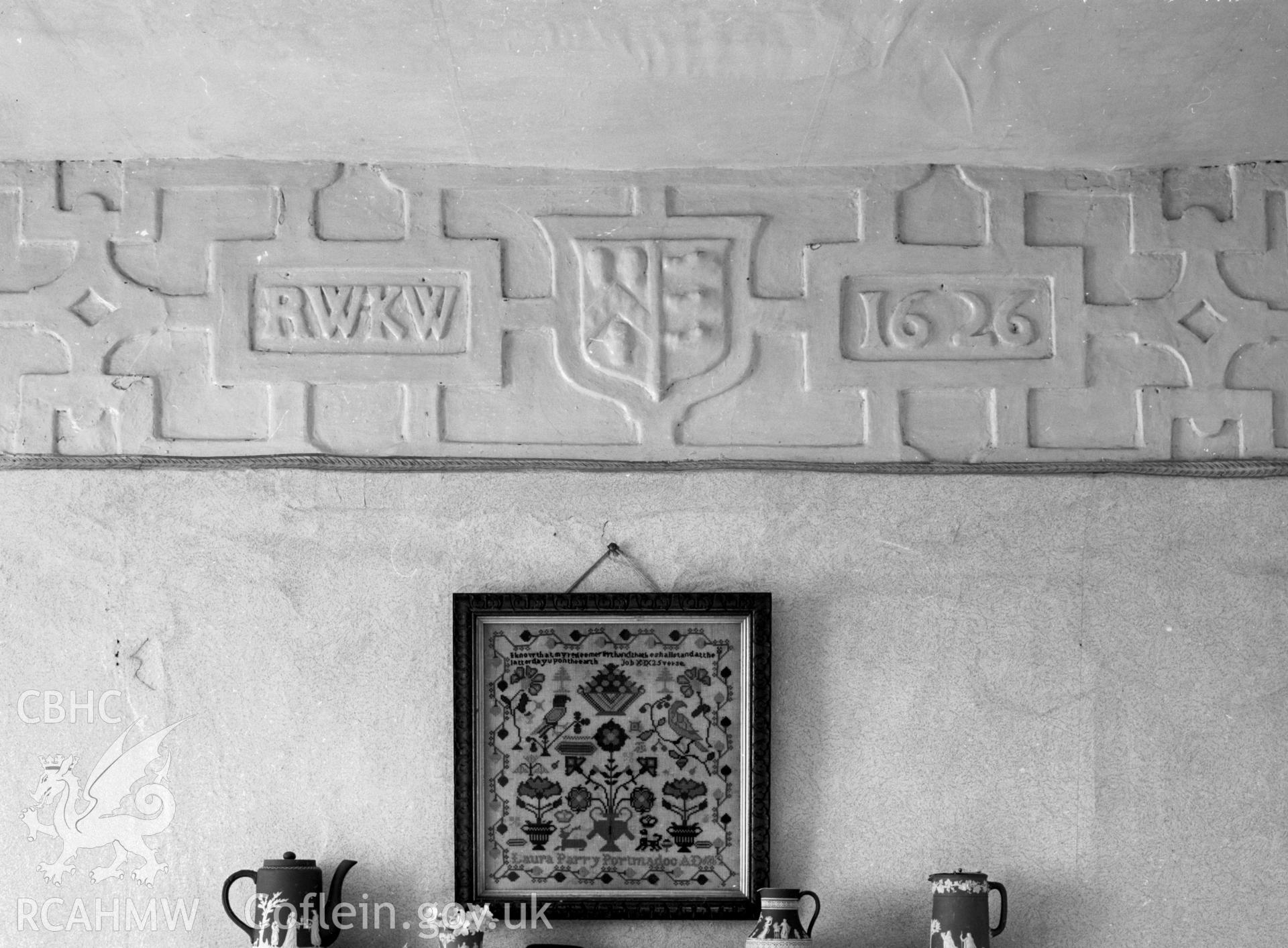 Plasterwork over fireplace showing a coat of arms, the letters RWKW and the date 1626.