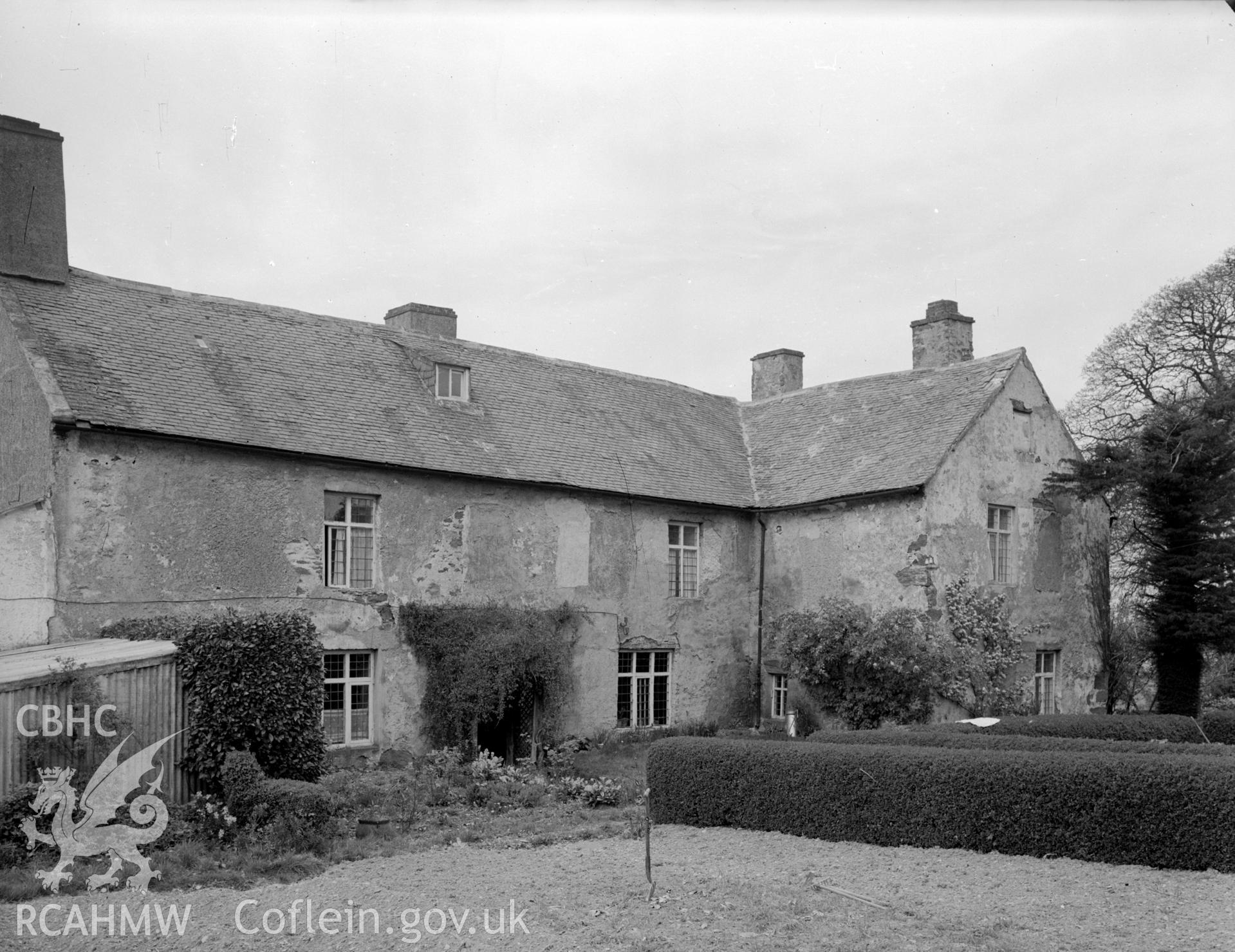 Slate roof with a small single dormer window.