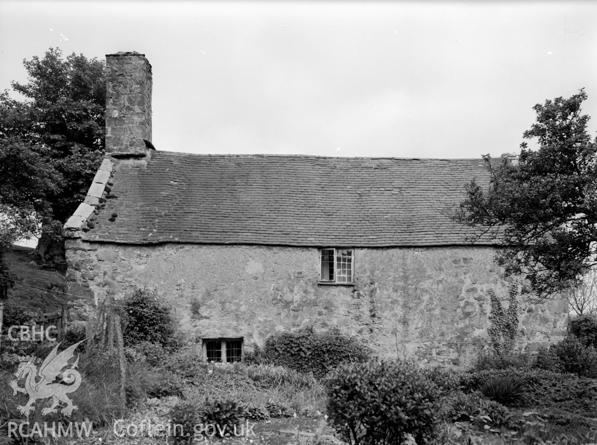 A view of two windows, one the ground floor the other on the first floor.