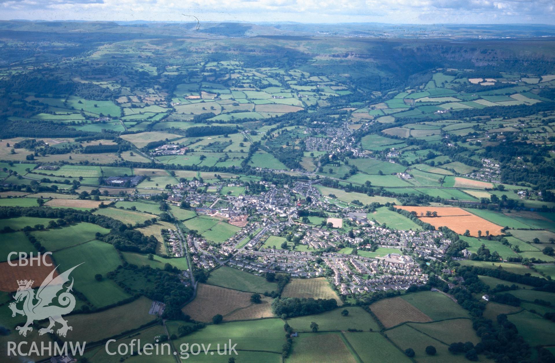 Slide of RCAHMW colour oblique aerial photograph of Crickhowell;crughywel  (medieval Town), taken by T.G. Driver, 24/7/1999.