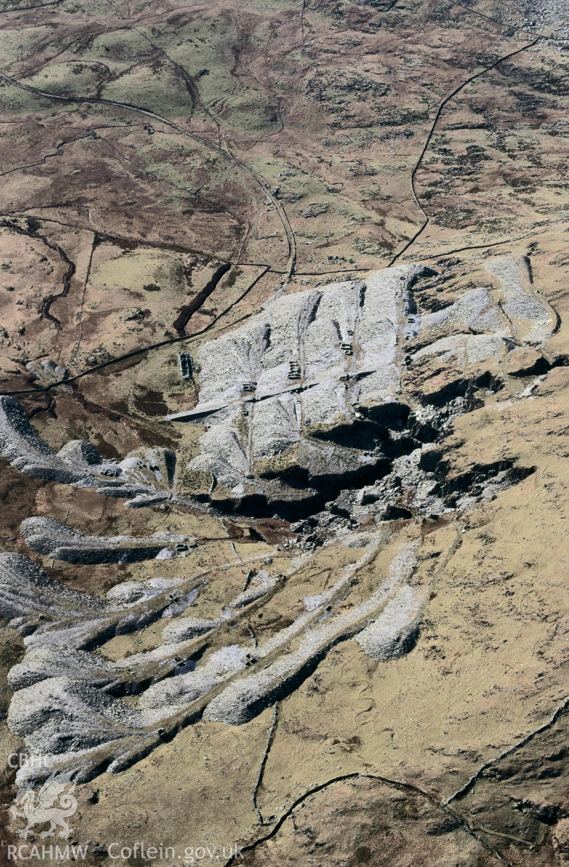 RCAHMW colour slide oblique aerial photograph of Gorseddau Slate Quarry, Dolbenmaen, taken by C.R.Musson on the 30/03/1996