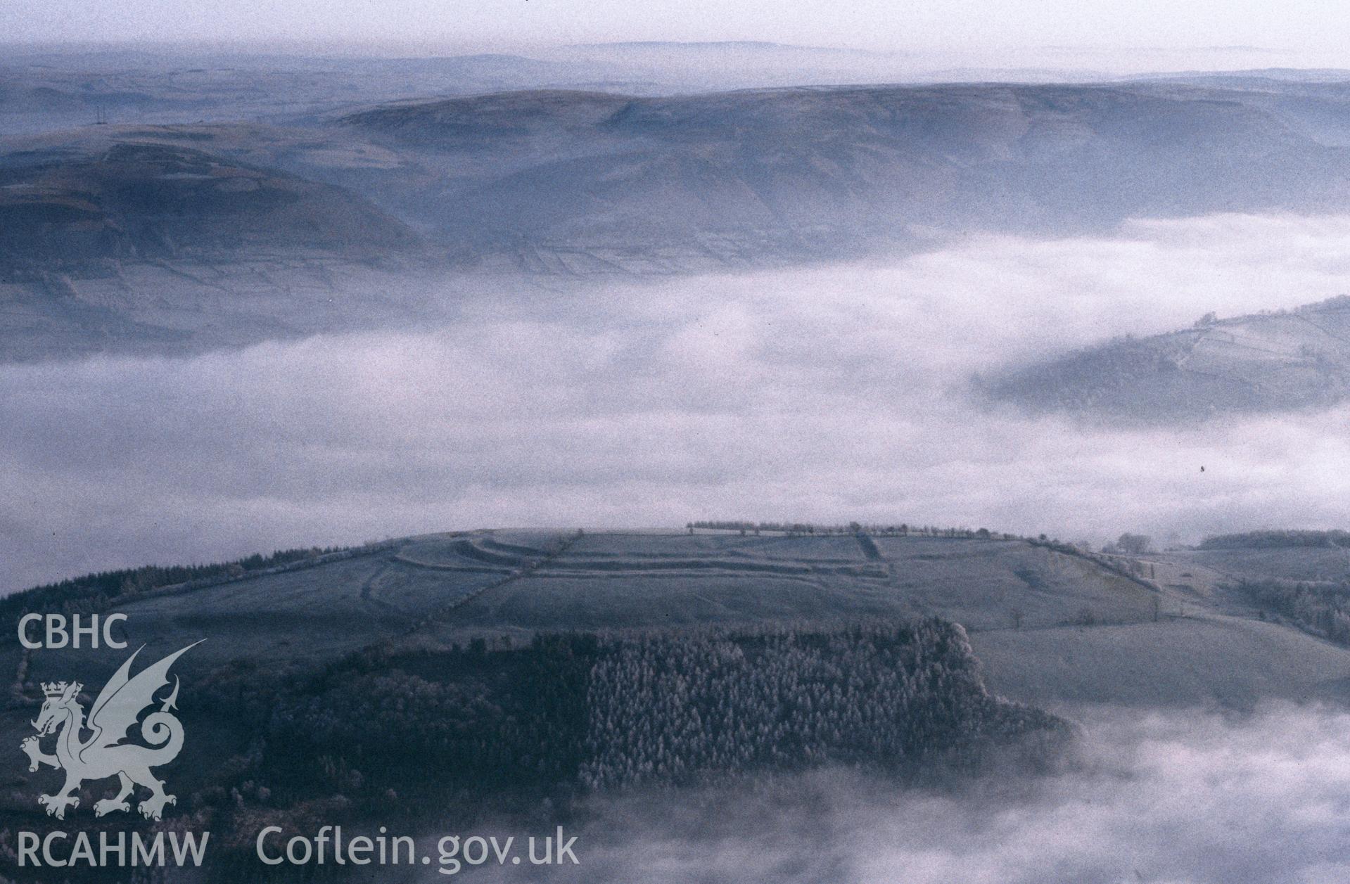 Slide of RCAHMW colour oblique aerial photograph of Cefn Carnedd Camp, taken by C.R. Musson, 22/1/1992.