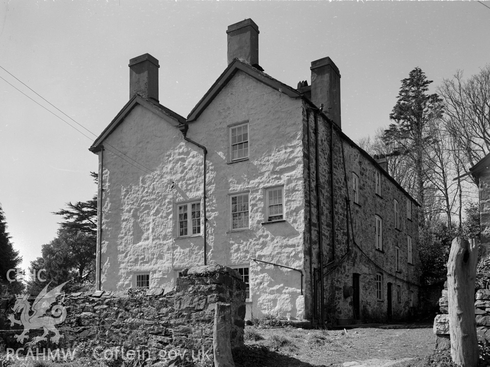 A photo of the side of the house. Shows two gable ends next to each other creating an M shape.