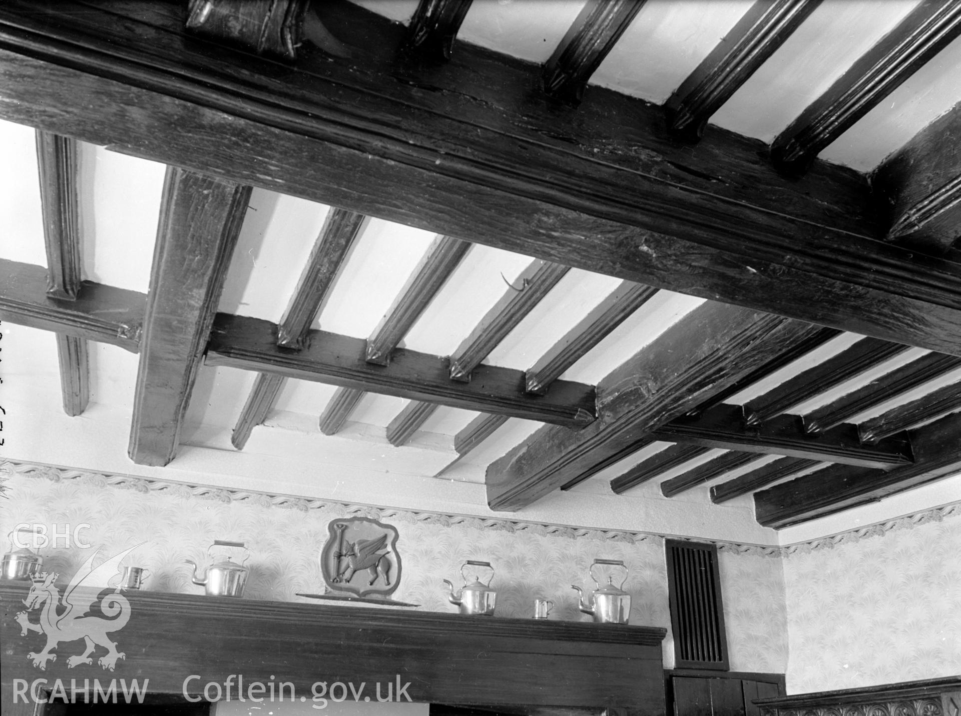 A photograph of the kitchen's moulded beam ceiling.