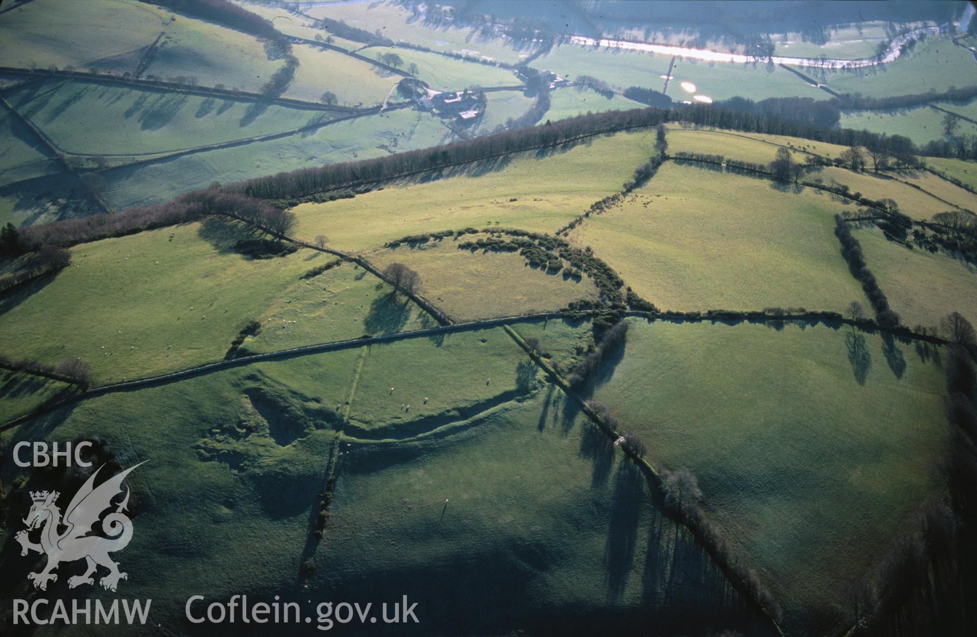 Slide of RCAHMW colour oblique aerial photograph of Pen Coed-foel Camp, taken by T.G. Driver, 19/12/1999.