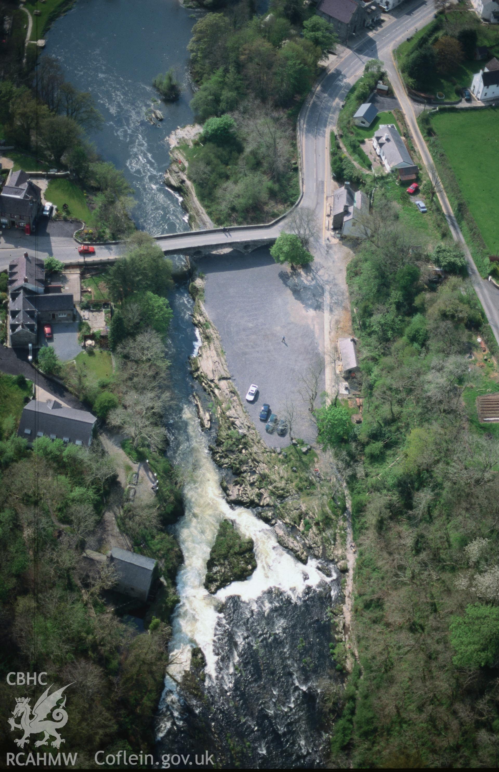 Slide of RCAHMW colour oblique aerial photograph of Cenarth Bridge, taken by C.R. Musson, 27/4/1999.
