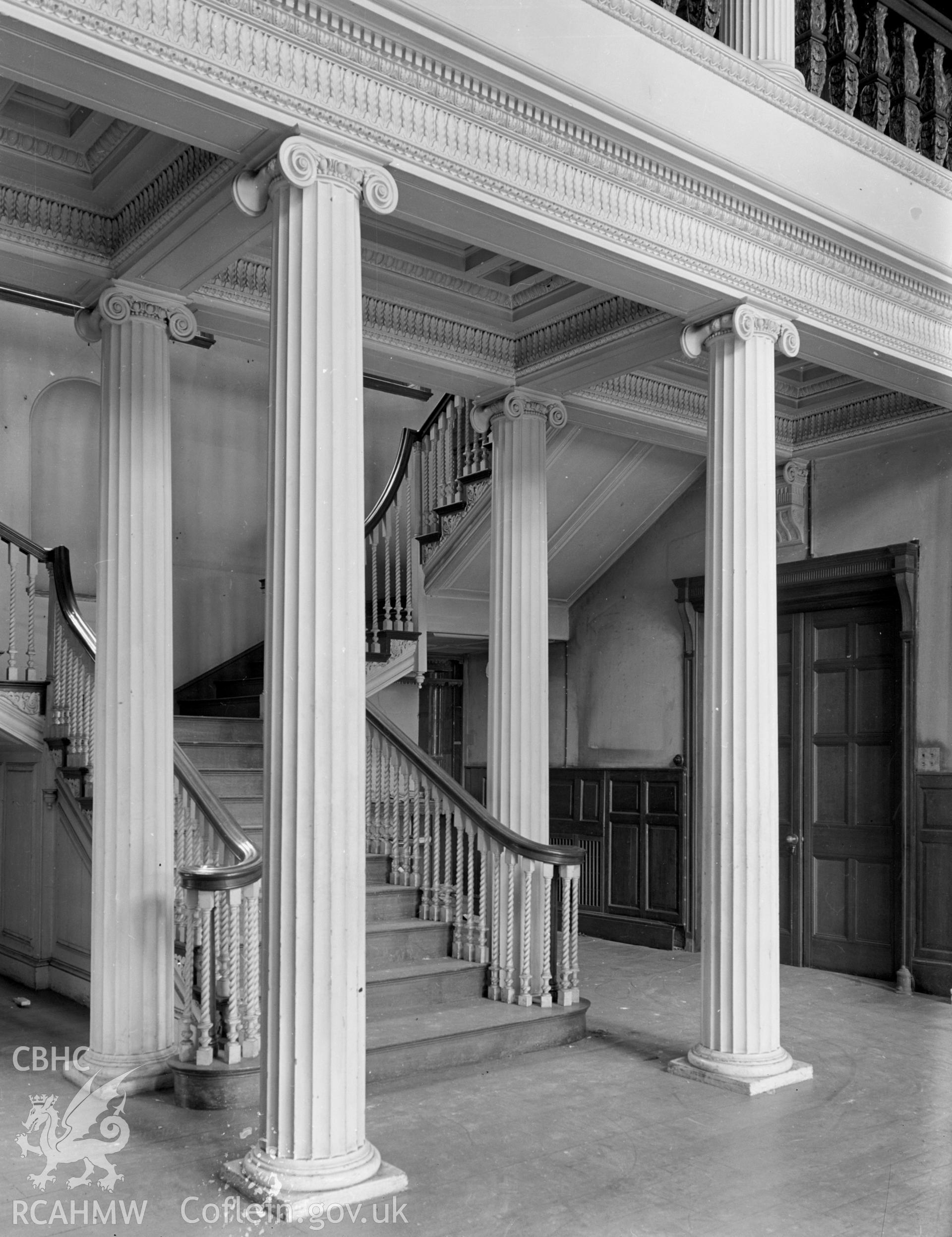 A view of the main staircase and four Ionic columns.