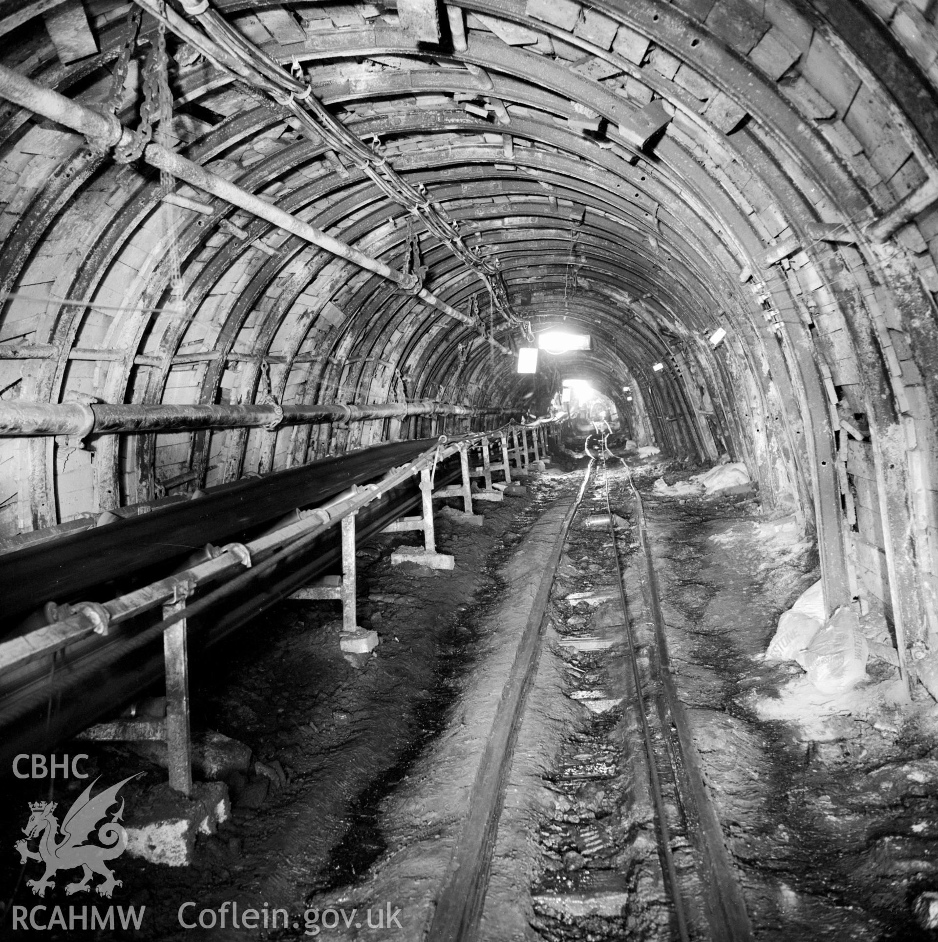 Trunk road with conveyor looking outbye, New Mine (Cornwell ref:410B). NA/MM/91/121e