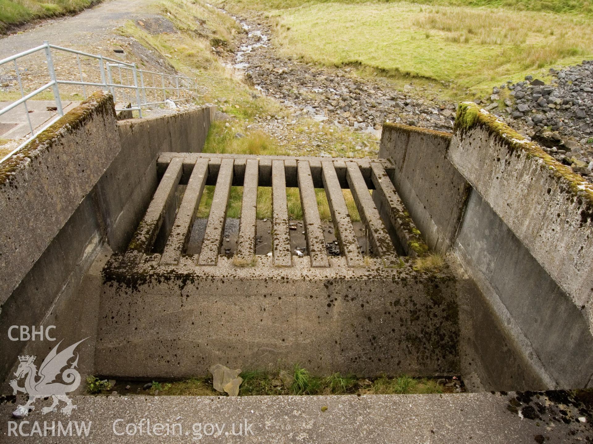 view looking E of conduit on N side of spillway.