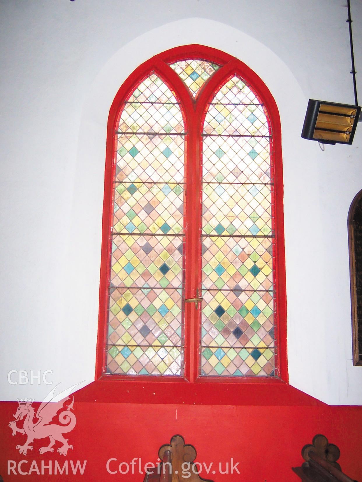 Colour digital photograph of the stained glass North window, West end.