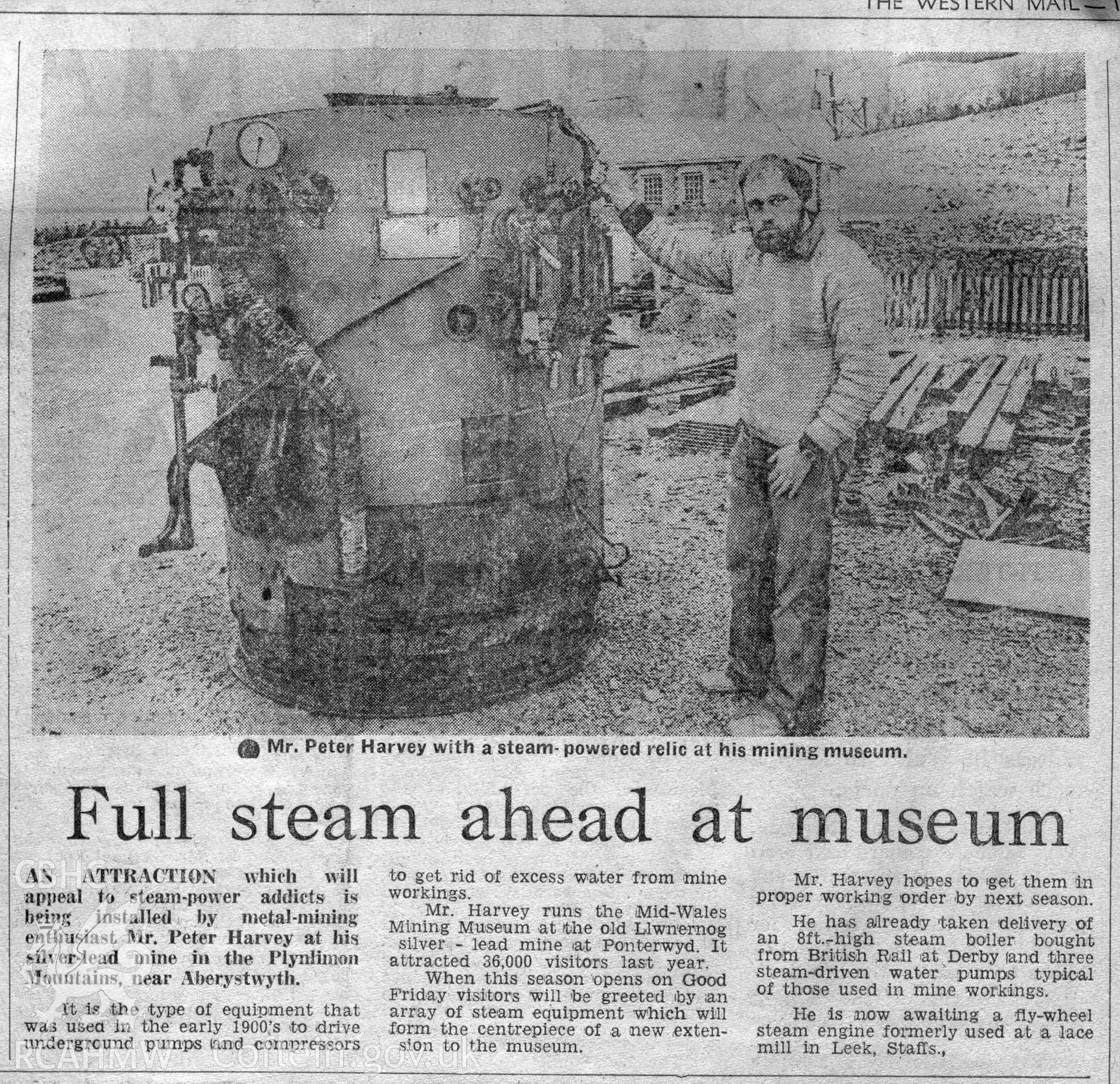 Digital copy of a newspaper cutting from the Western Mail. The article details the acquistition of an early 20th century steam pump acquired by Mr Peter Harvey, who ran the Mid-Wales Mining Museum at Llywernog Mine, Ponterwyd. Part of the article is a photograph of Peter Harvey standing next to the new acquisition.