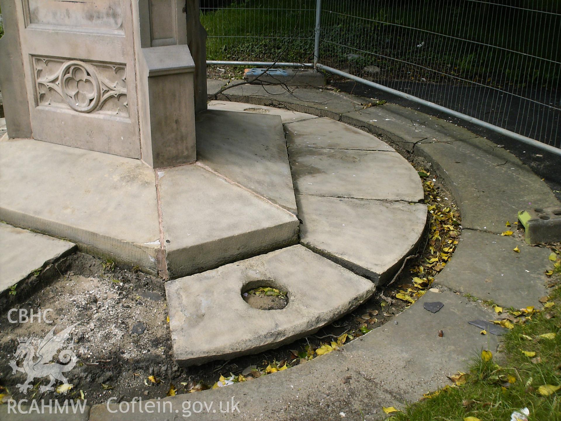 Digital image showing the kerb stones being removed, and the paving being restored.
