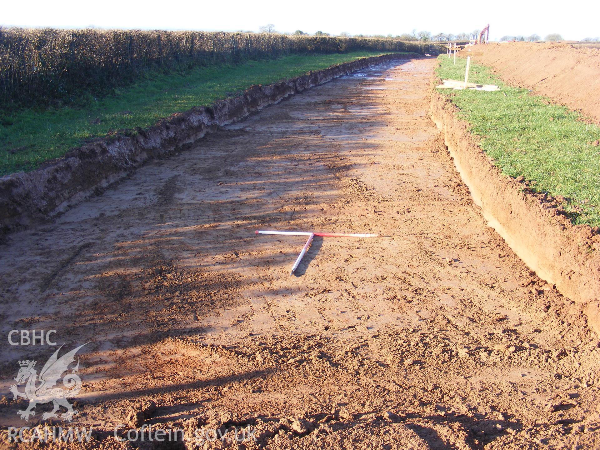 View showing up-slope shot at Track E, taken at archaeological watching brief at Princes Gate Spring Water, produced by Headland Archaeology (UK) Ltd., 2014.