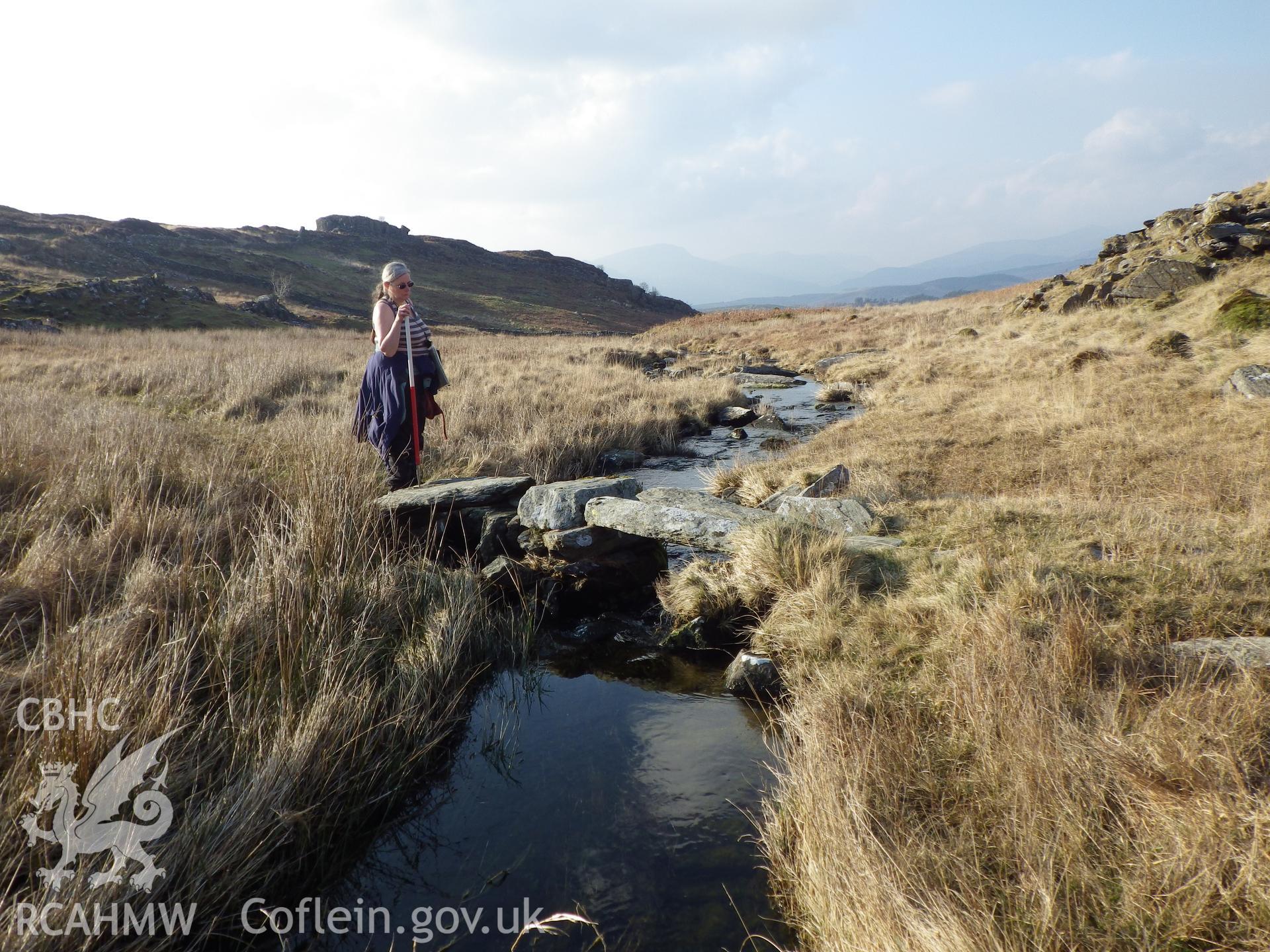 Clapper style footbridge over stream, looking northwest