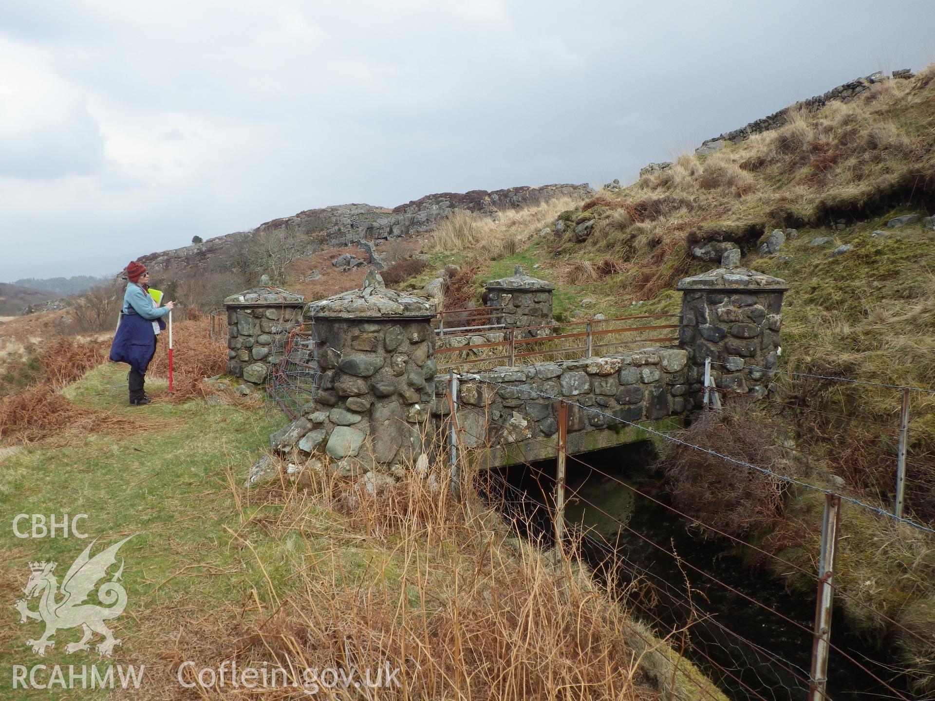 Stone, cement bridge across conduit, looking northeast