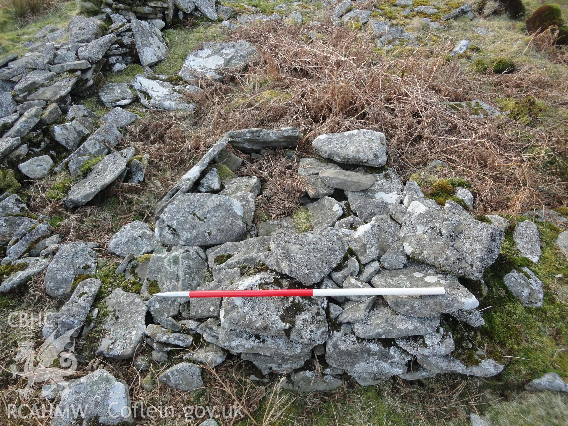 Detail of stone pile at eastern end of long hut, looking south southwest.