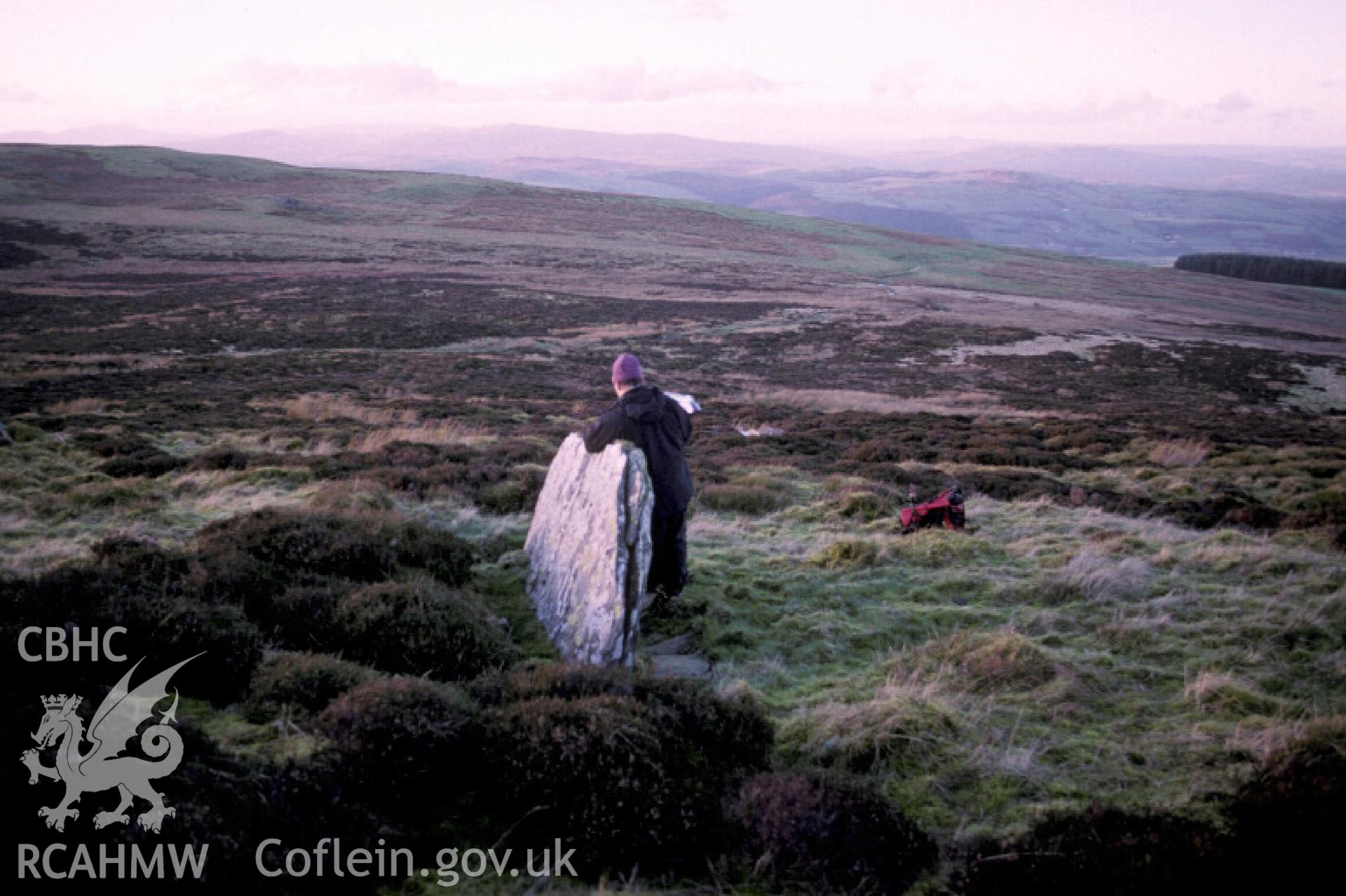 Photograph of Moel Pearce Standing Stone from the south-east. Taken by R. Hankinson on 13/01/2005 during an upland survey undertaken by the Clwyd-Powys Archaeological Trust.