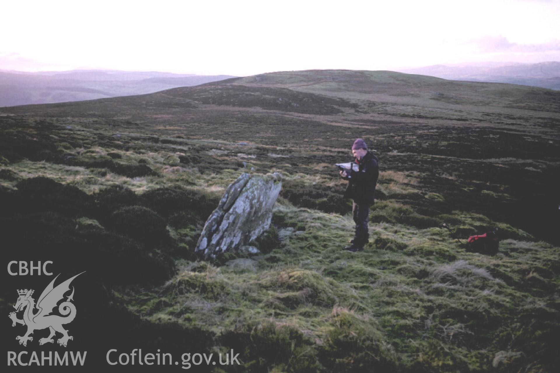 Photograph of Moel Pearce Standing Stone from the east. Taken by R. Hankinson on 13/01/2005 during an upland survey undertaken by the Clwyd-Powys Archaeological Trust.