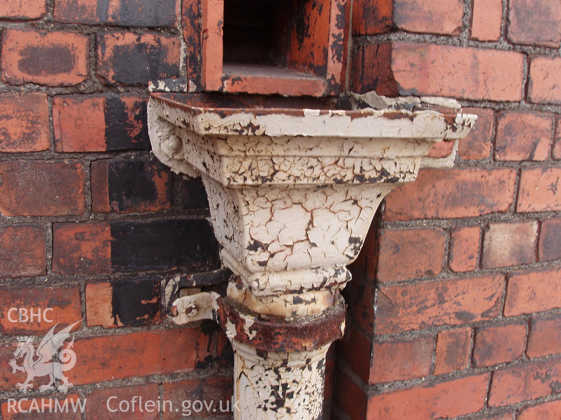 Colour digital photograph detailing a drainpipe at the Malt House, East Dock Road, Newport.  The photograph was taken after the building was severely damaged by fire.