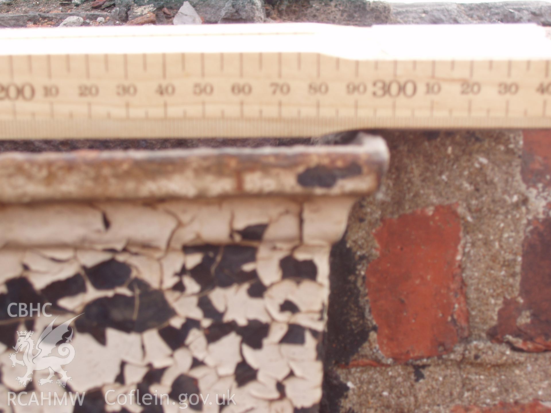 Colour digital photograph detailing a drainpipe at the Malt House, East Dock Road, Newport.  The photograph was taken after the building was severely damaged by fire.