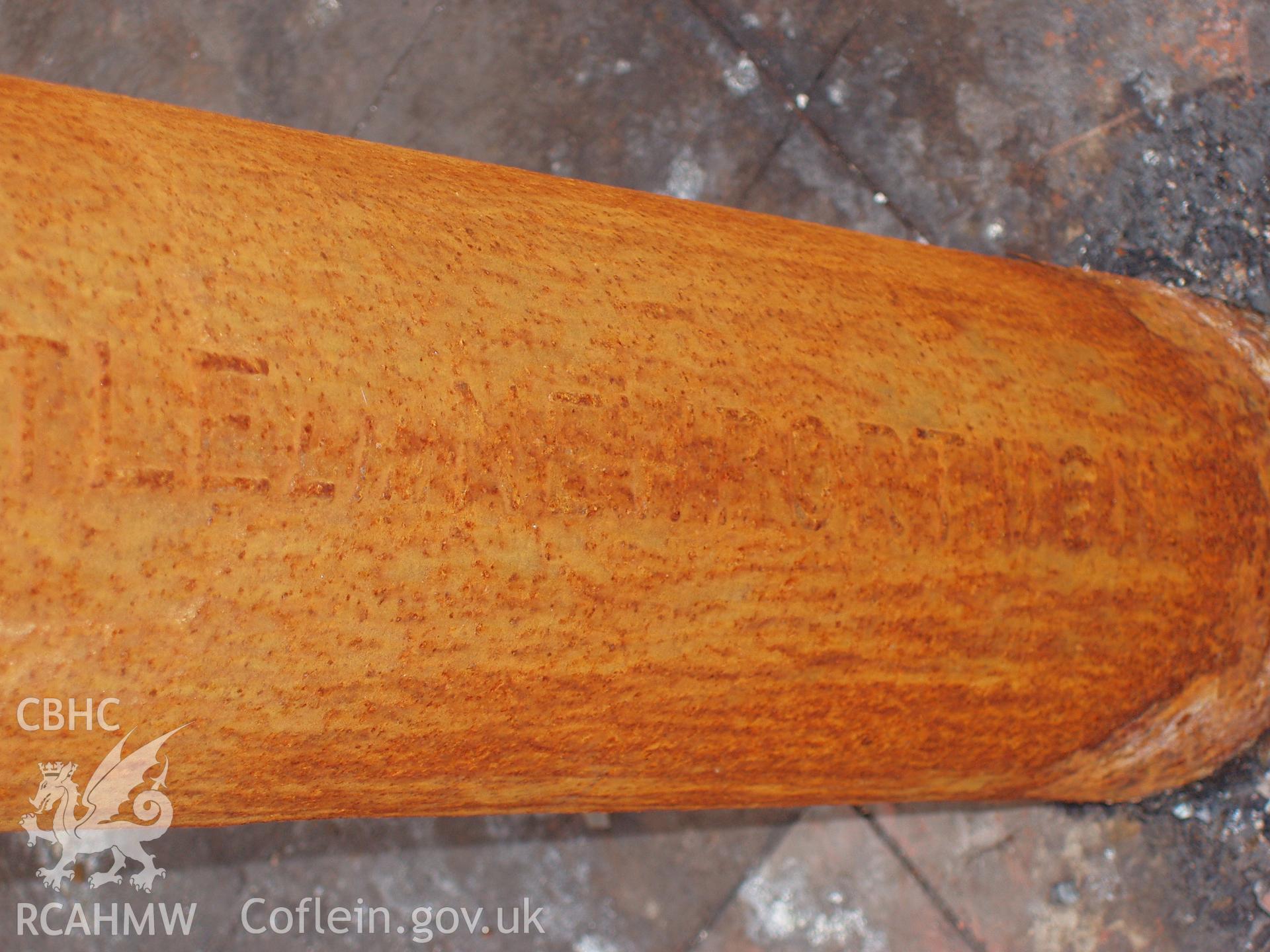 Colour digital photograph detailing a post in the Malt House, East Dock Road, Newport.  The photograph was taken after the Malt House was severely damaged by fire.