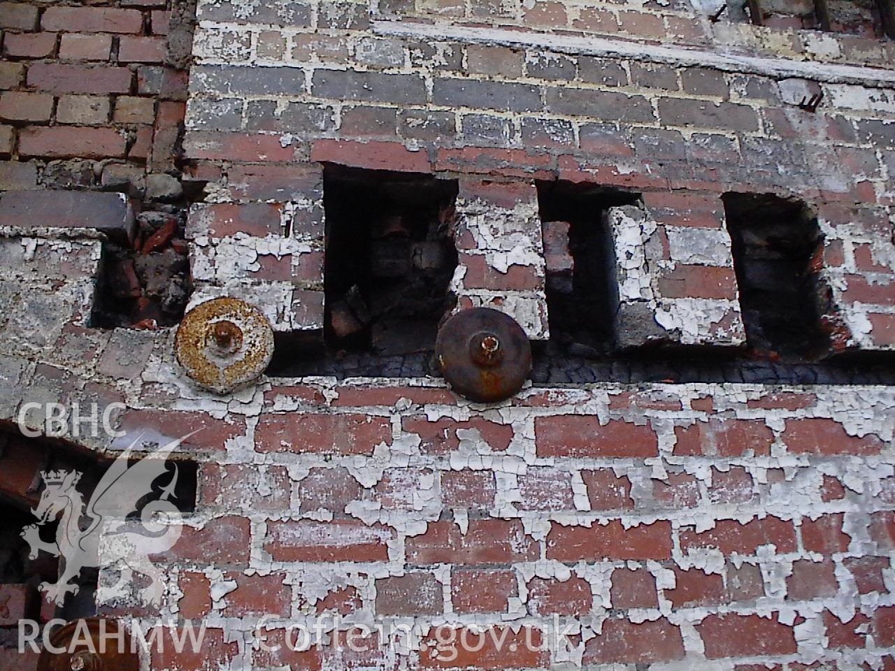 Colour digital photograph showing a brick wall at the Malt House, East Dock Road, Newport. The photograph was taken after the Malt House was severely damaged by fire.