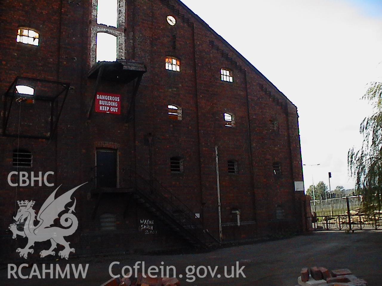 Colour digital photograph showing part of an exterior wall at the Malt House, East Dock Road, Newport.  The photograph was taken after the Malt House was severely damaged by fire.