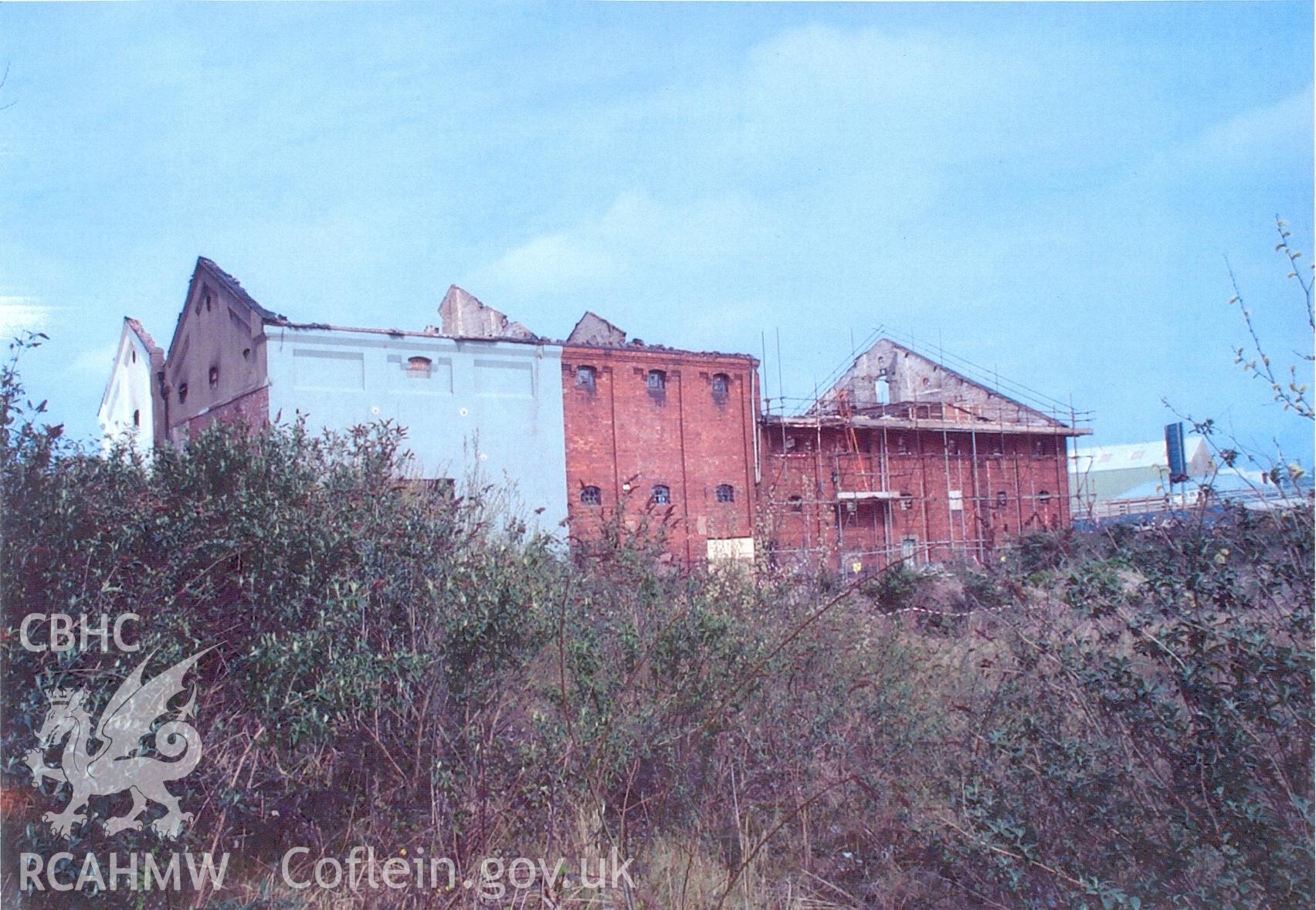 Colour scan of a photograph showing the exterior of the Malt House, East Dock Road, Newport. The photograph was taken after a fire severely damaged the building.