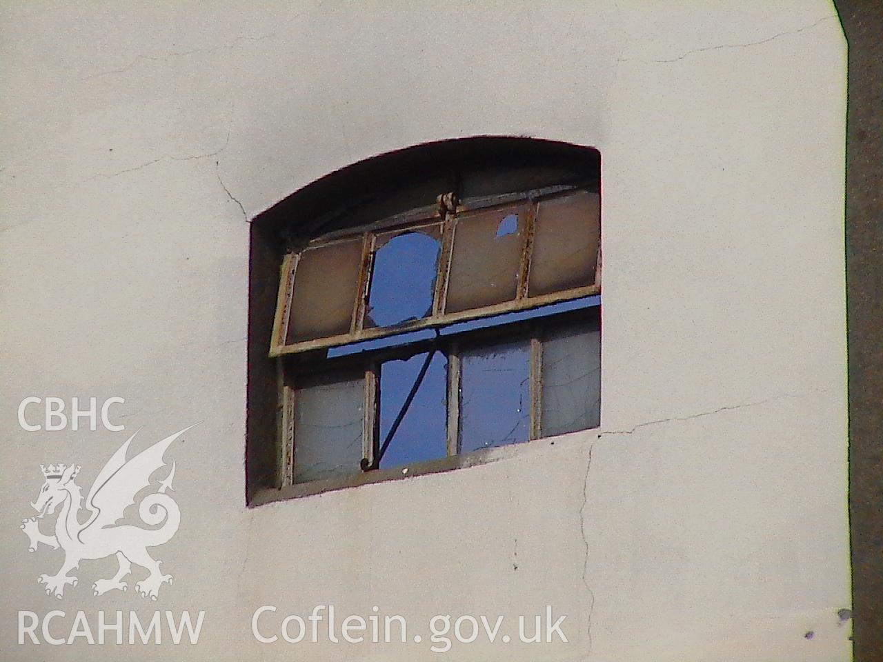 Colour digital photograph showing a window at the Malt House, East Dock Road, Newport.  The photograph was taken after the Malt House was severely damaged by fire.