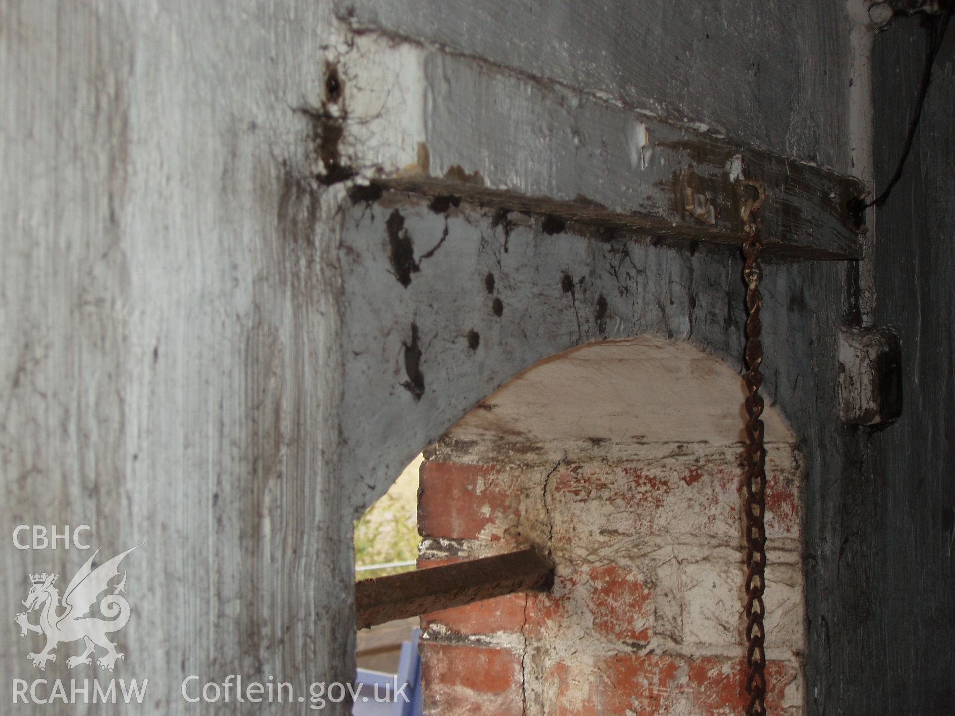 Colour digital photograph showing a barred window at the Malt House, East Dock Road, Newport.  The photograph was taken after the Malt House was severely damaged by fire.