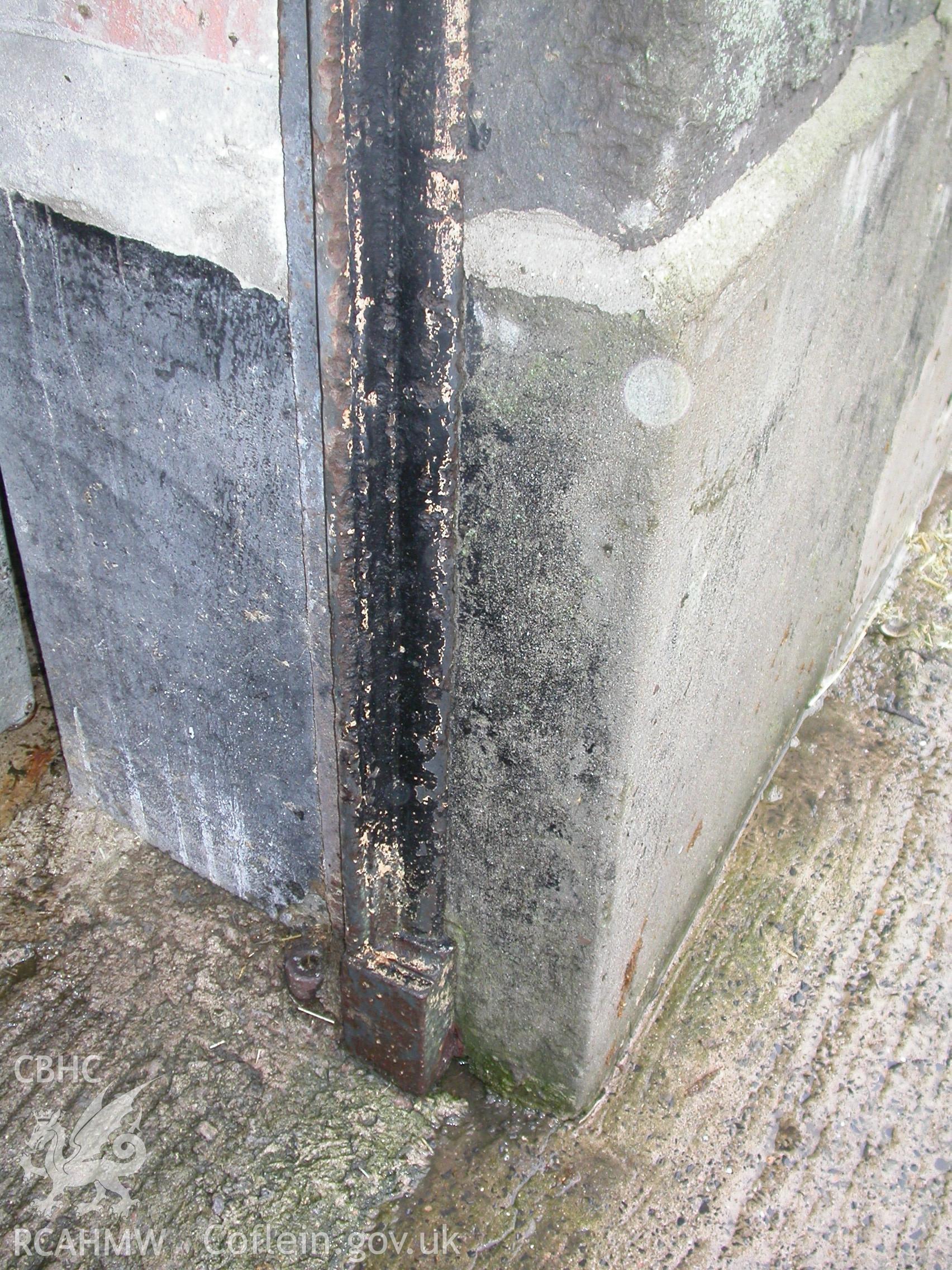Digital colour photograph showing detail of a door frame and hinge bracket at the gable end of the South range of Newport Cattle market.