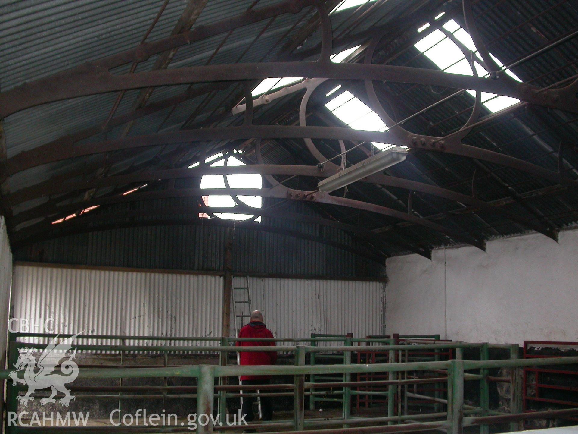 Digital colour photograph showing a general view of roof trusses in interior of the South range of Newport Cattle market.
