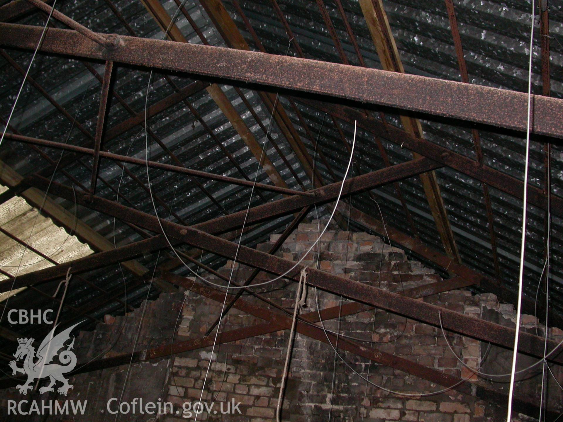 Digital colour photograph showing wrought iron trusses in the North East corner building of Newport Cattle market.