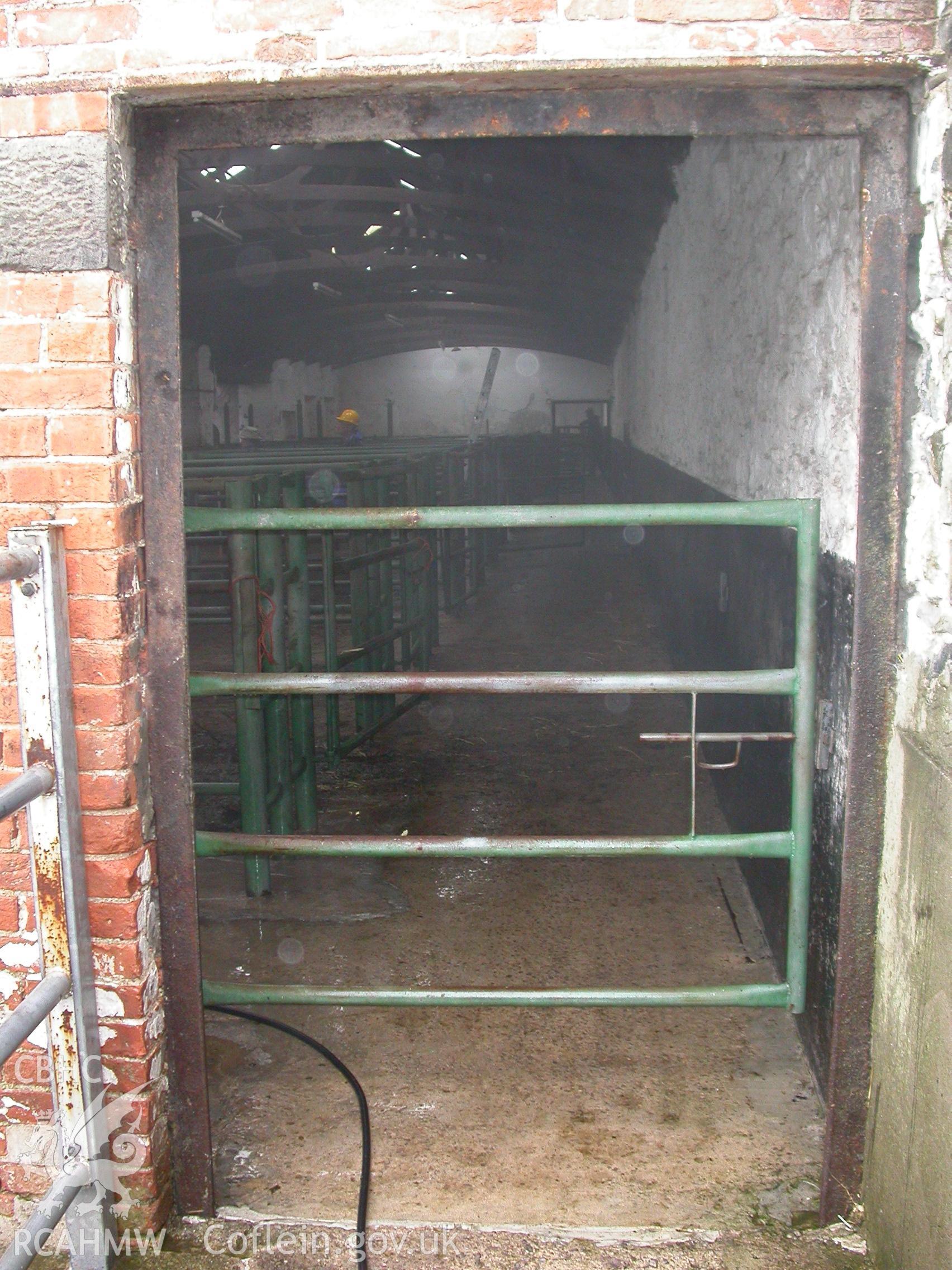 Digital colour photograph showing a doorway at the gable end of the South range of Newport Cattle market.