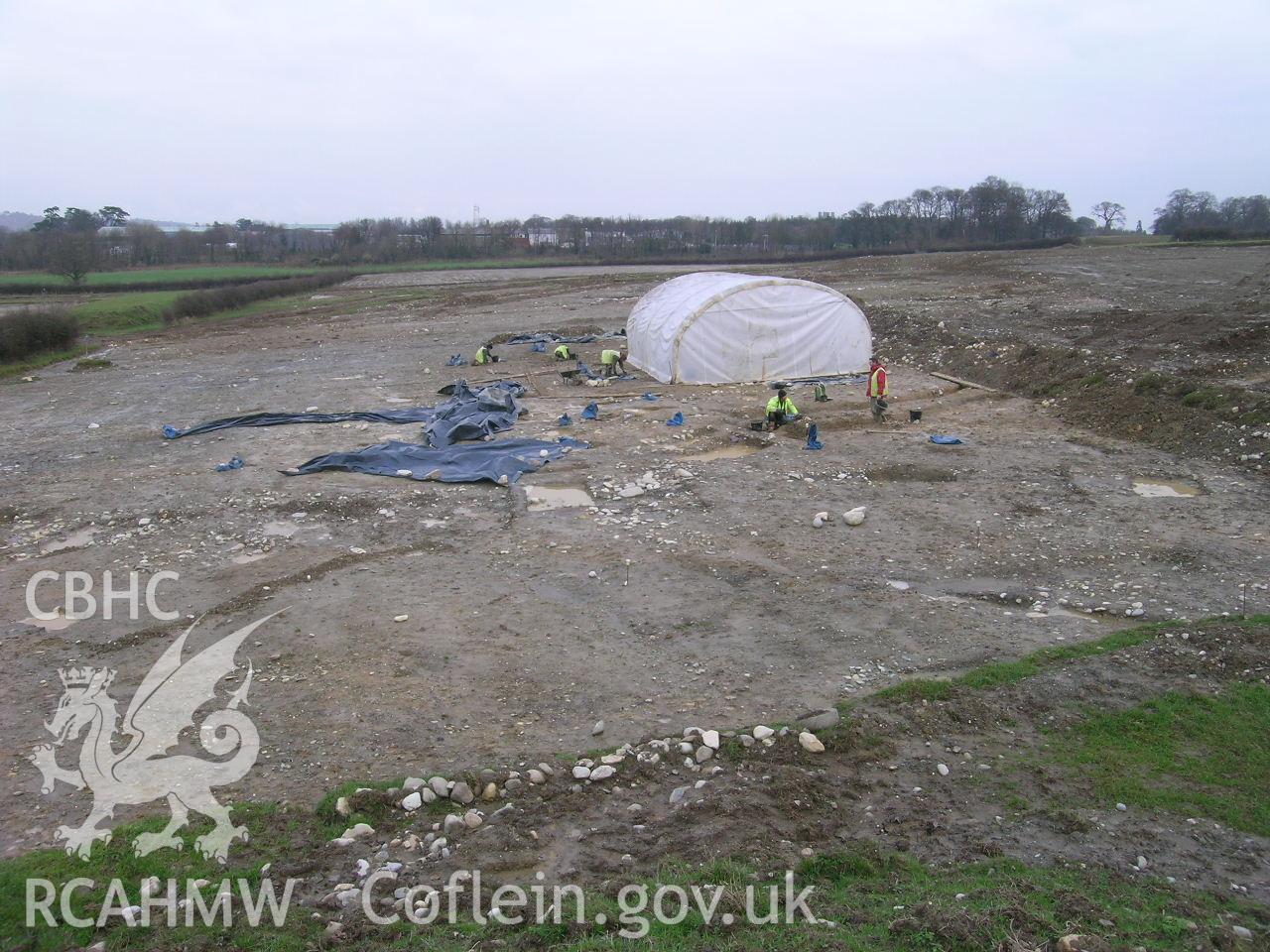 Digital photograph from excavation of Parc Bryn Cegin, Llandygai, by Gwynedd Archaeological Trust. Work shelter, from S (numbers refer to context records). Scale 1x0.5m.