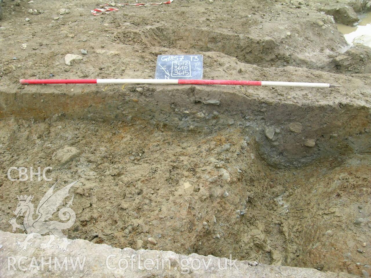 Digital photograph from excavation of Parc Bryn Cegin, Llandygai, by Gwynedd Archaeological Trust. NE facing section through ditches 3610, 3612, 3615, from NE (numbers refer to context records). Scale 1x2m.