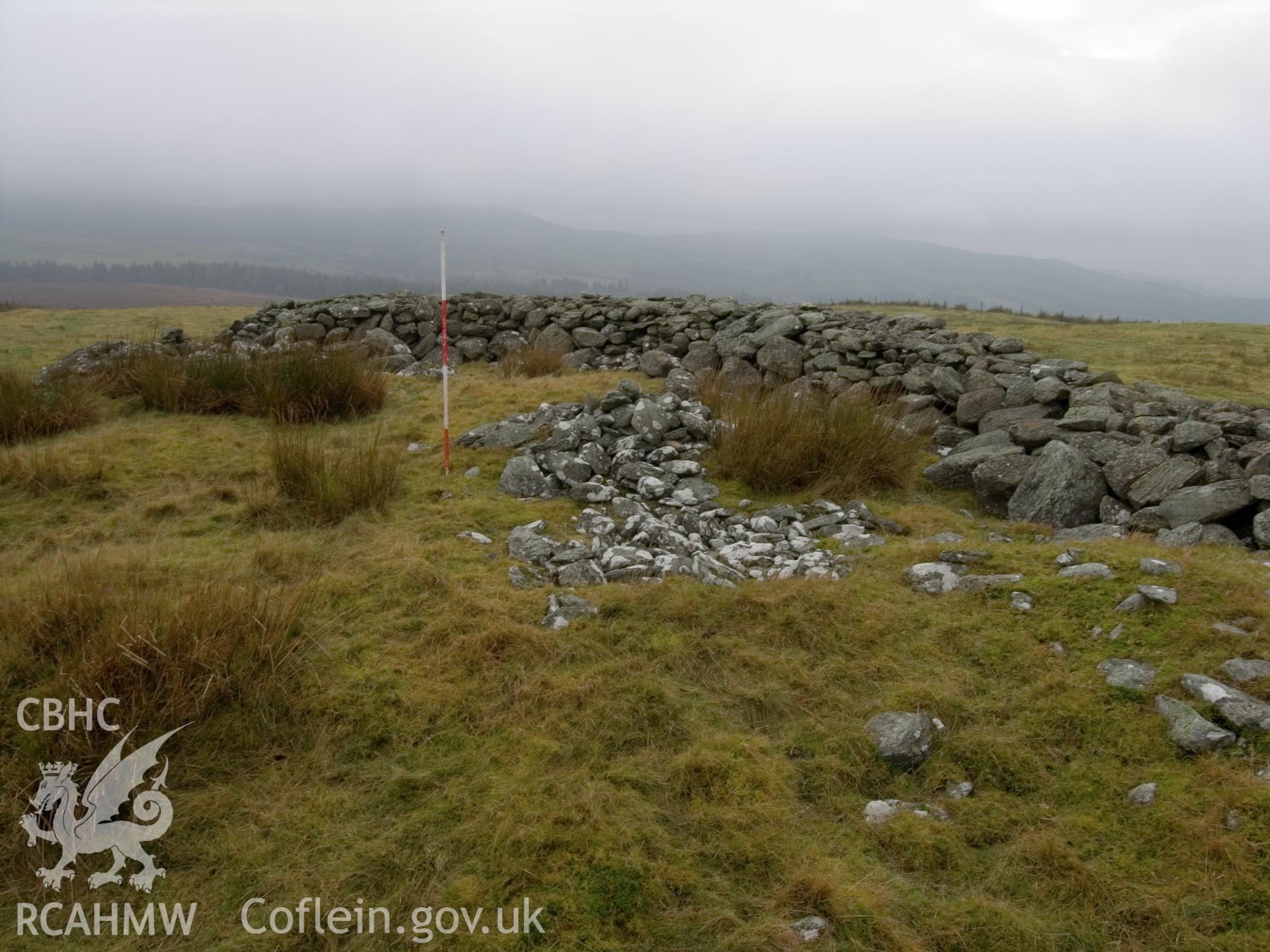 view looking S showing exposed stones in centre.