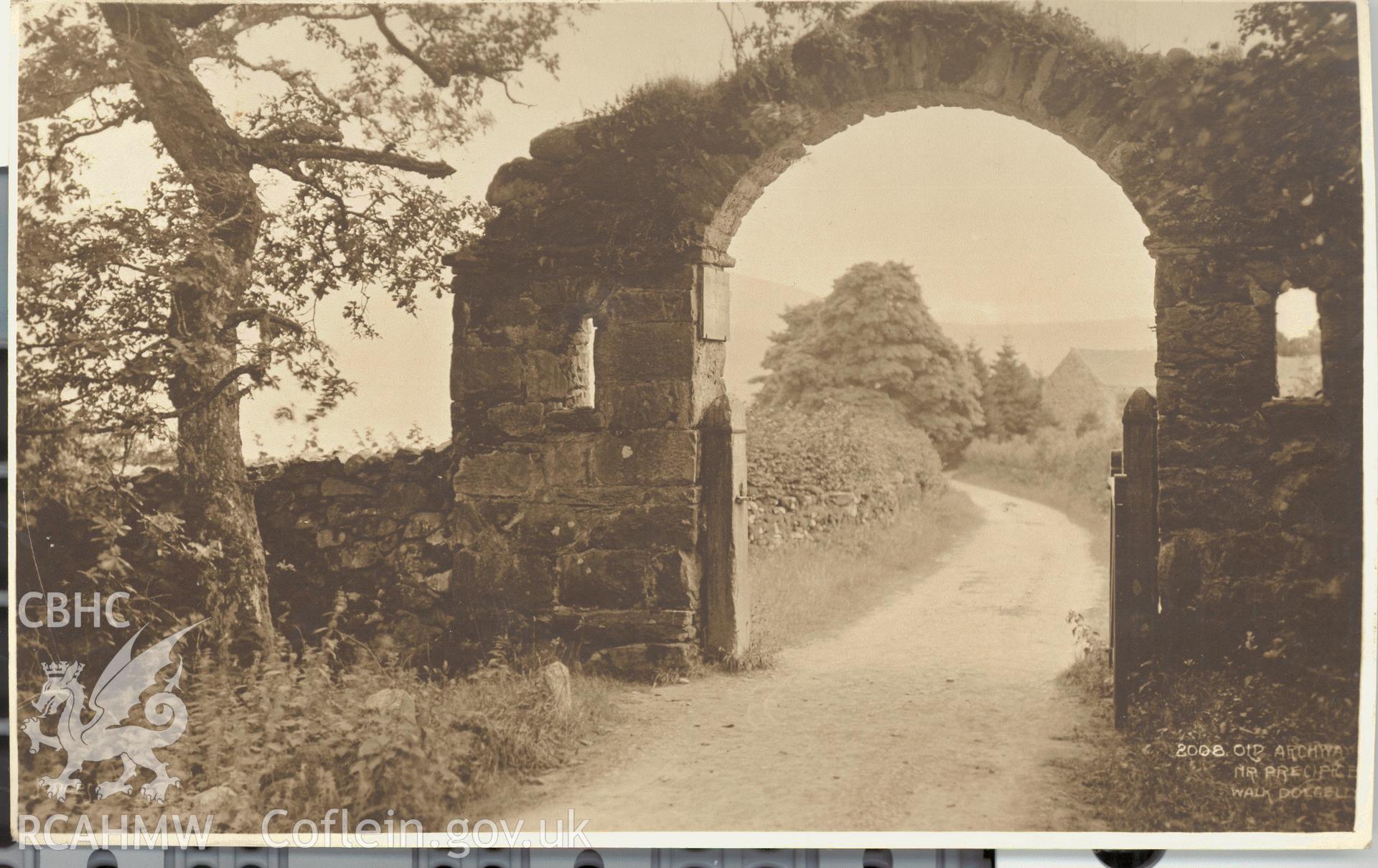 Digitised postcard image of Arch at Maes-y-Bryner, Nannau Park, Judges Ltd. Produced by Parks and Gardens Data Services, from an original item in the Peter Davis Collection at Parks and Gardens UK. We hold only web-resolution images of this collection, suitable for viewing on screen and for research purposes only. We do not hold the original images, or publication quality scans.