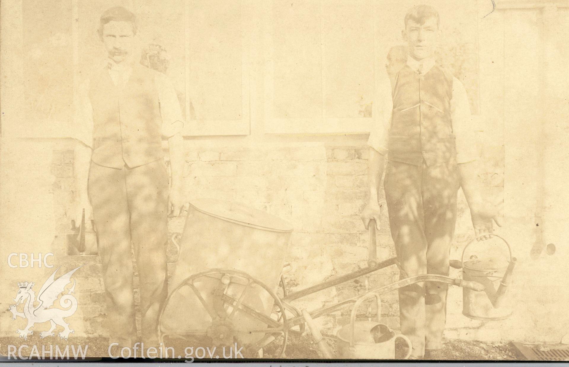 Digitised postcard image of head gardener T. Thomas (left) and undergardener at Derry Ormond, Betws Bledrws. Produced by Parks and Gardens Data Services, from an original item in the Peter Davis Collection at Parks and Gardens UK. We hold only web-resolution images of this collection, suitable for viewing on screen and for research purposes only. We do not hold the original images, or publication quality scans.