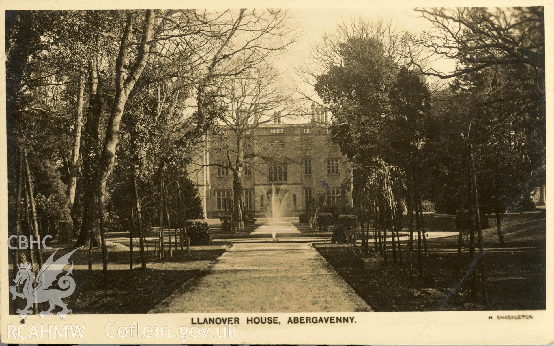 Digitised postcard image of Llanover House, Llanover, with fountain, H Shackleton. Produced by Parks and Gardens Data Services, from an original item in the Peter Davis Collection at Parks and Gardens UK. We hold only web-resolution images of this collection, suitable for viewing on screen and for research purposes only. We do not hold the original images, or publication quality scans.