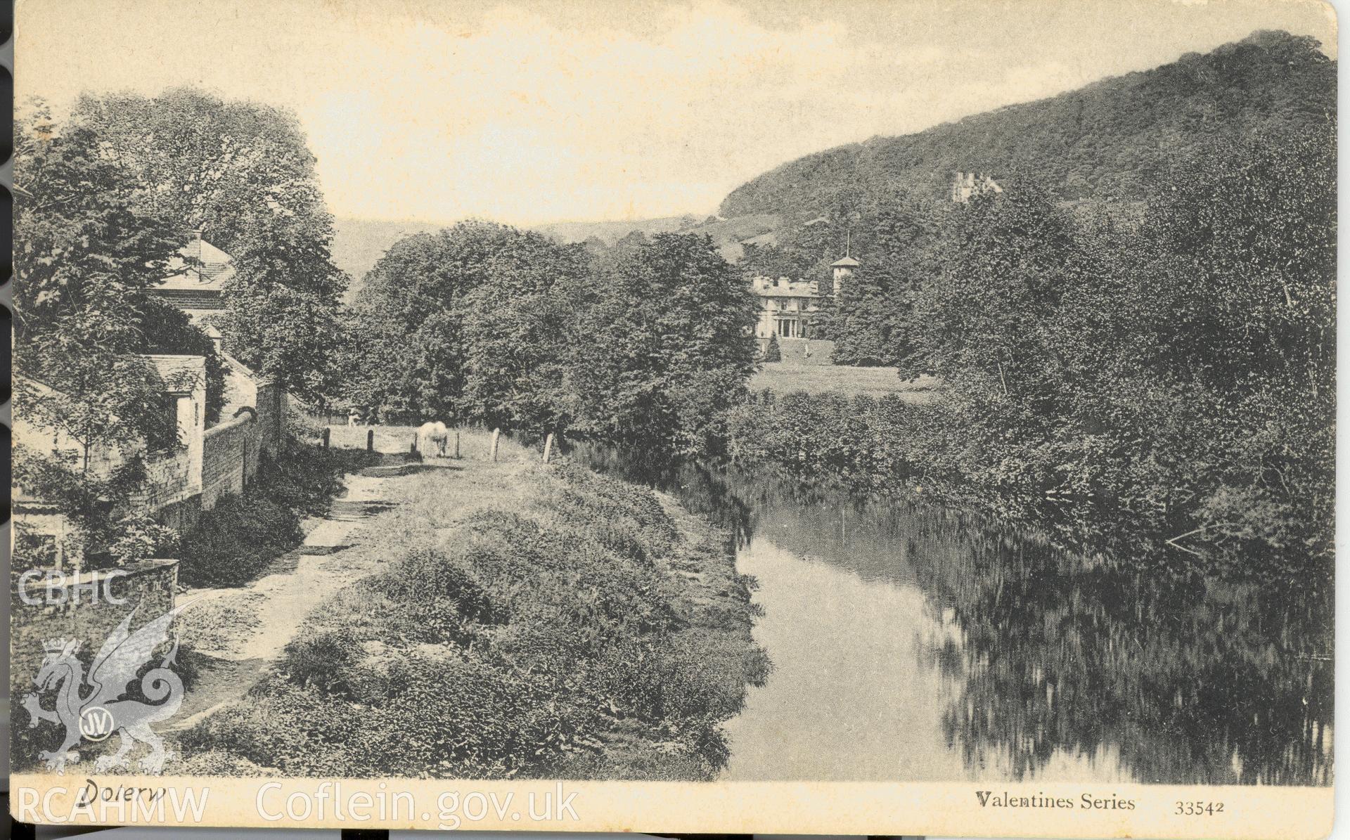 Digitised postcard image of Dolerw, Newtown from the river, Valentine and Sons Ltd. Produced by Parks and Gardens Data Services, from an original item in the Peter Davis Collection at Parks and Gardens UK. We hold only web-resolution images of this collection, suitable for viewing on screen and for research purposes only. We do not hold the original images, or publication quality scans.