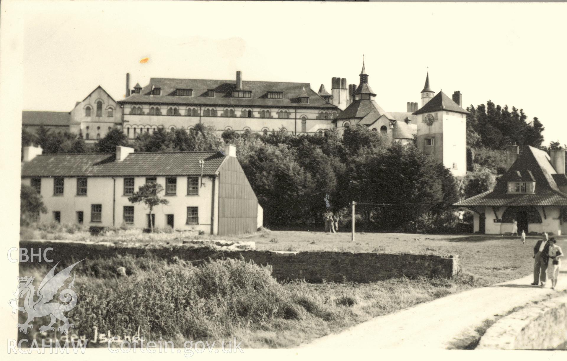 Digitised postcard image of Caldey Monastery, Caldey Island, Squibbs Studios. Produced by Parks and Gardens Data Services, from an original item in the Peter Davis Collection at Parks and Gardens UK. We hold only web-resolution images of this collection, suitable for viewing on screen and for research purposes only. We do not hold the original images, or publication quality scans.