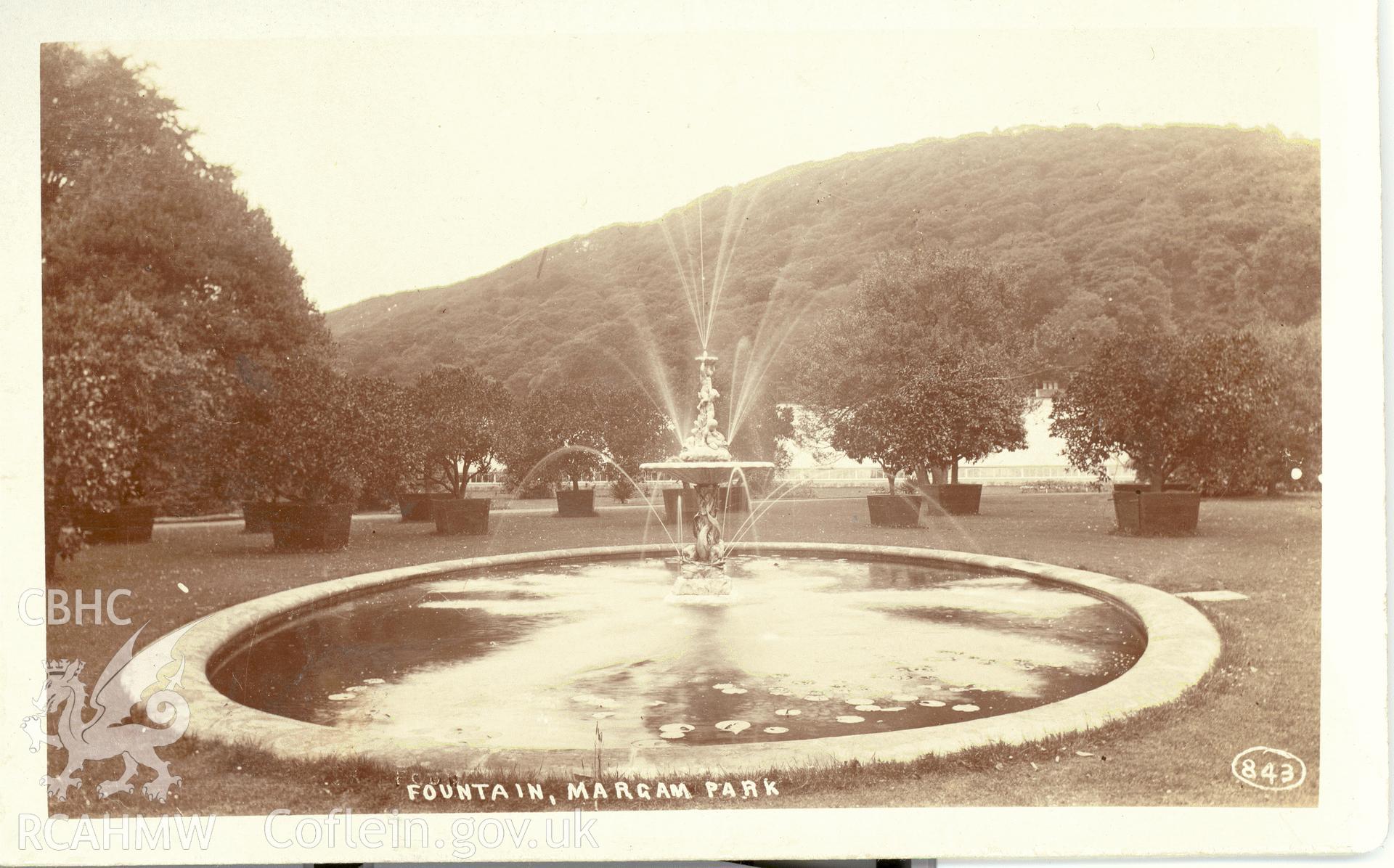 Digitised postcard image of fountain, Margam park gardens,  E. Miles, Ewenny Road Studio, Bridgend. Produced by Parks and Gardens Data Services, from an original item in the Peter Davis Collection at Parks and Gardens UK. We hold only web-resolution images of this collection, suitable for viewing on screen and for research purposes only. We do not hold the original images, or publication quality scans.