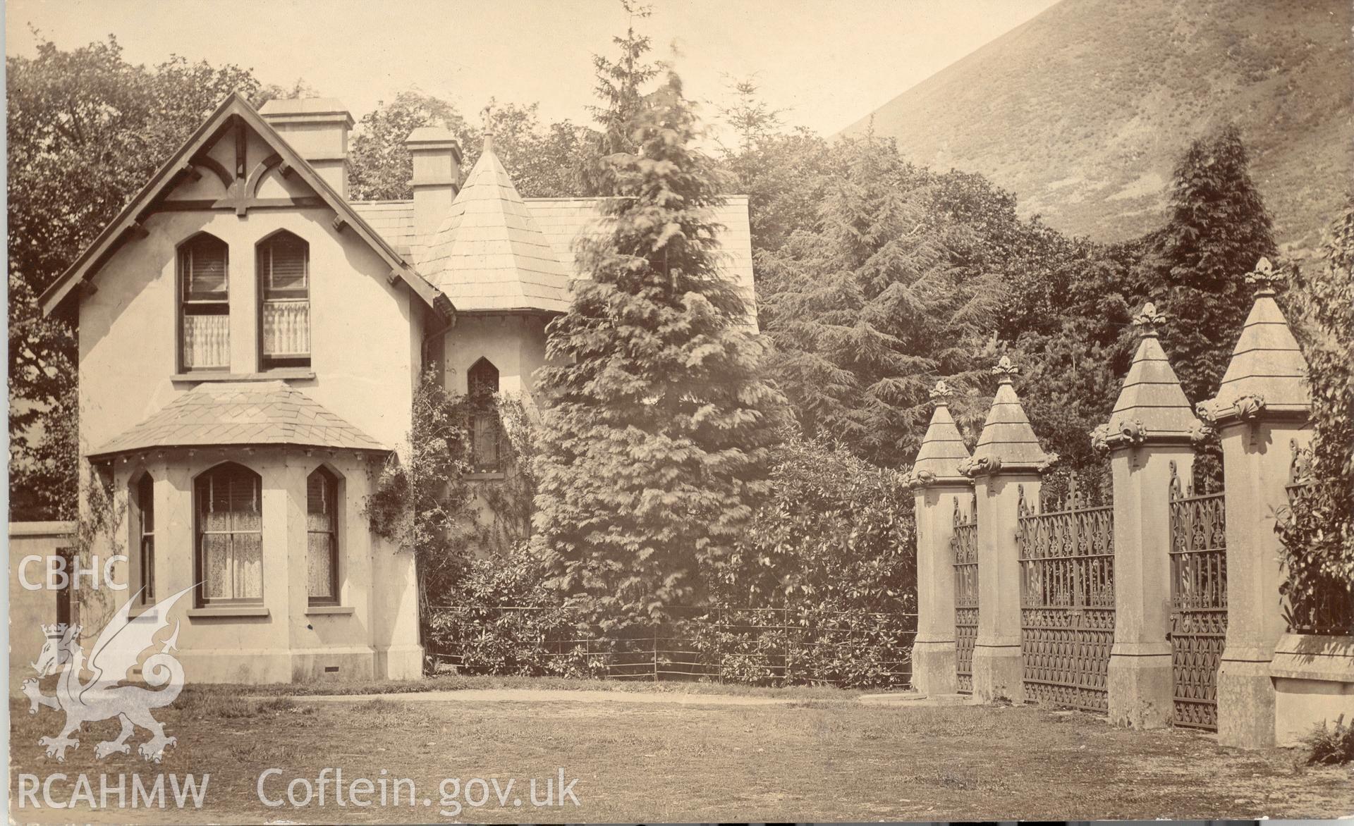 Digitised postcard image of Plas Dinas Mawddwy lodge. Produced by Parks and Gardens Data Services, from an original item in the Peter Davis Collection at Parks and Gardens UK. We hold only web-resolution images of this collection, suitable for viewing on screen and for research purposes only. We do not hold the original images, or publication quality scans.