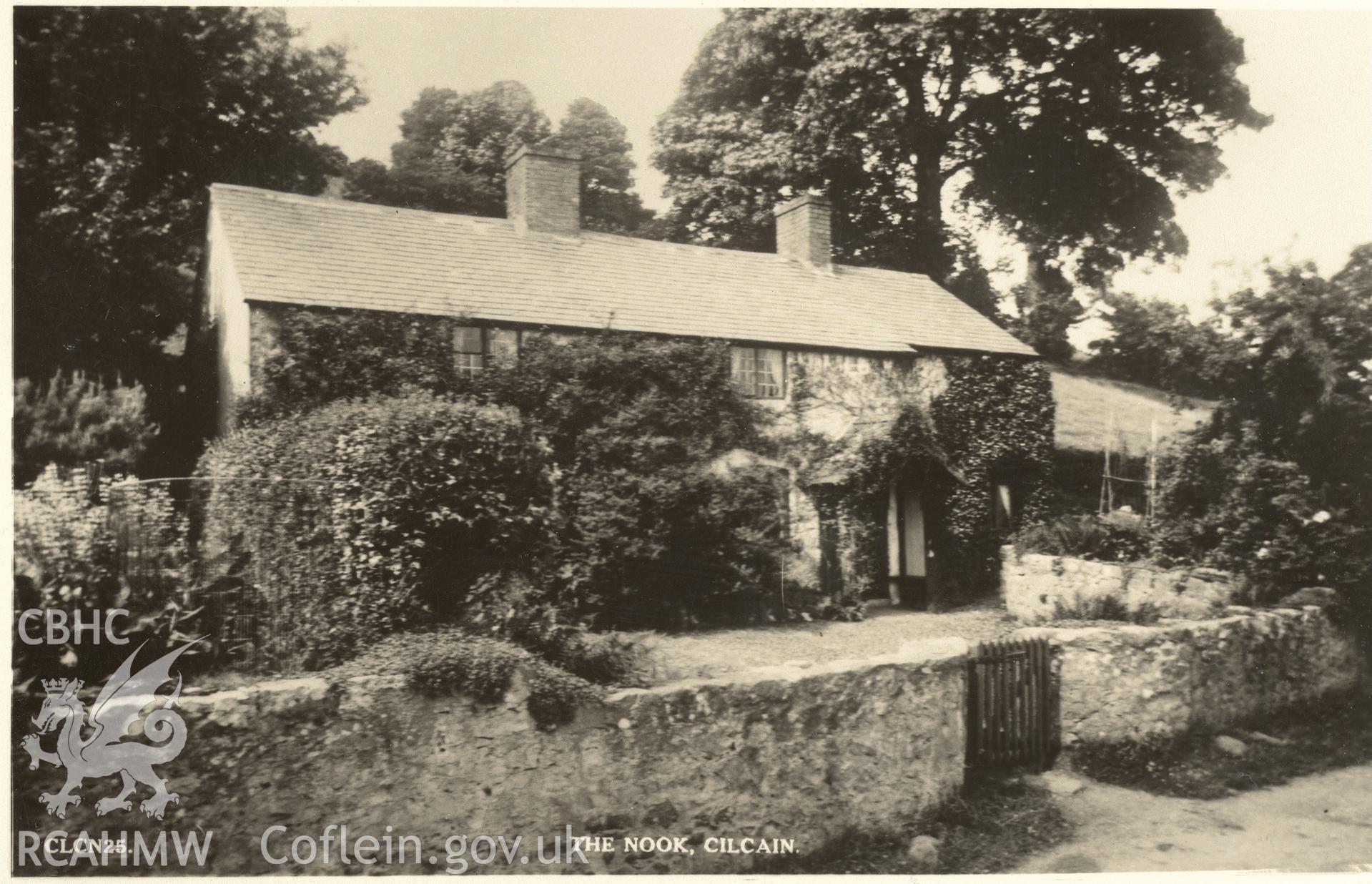 Digitised postcard image of The Nook, Cilcain, Raphael Tuck and Sons Ltd. Produced by Parks and Gardens Data Services, from an original item in the Peter Davis Collection at Parks and Gardens UK. We hold only web-resolution images of this collection, suitable for viewing on screen and for research purposes only. We do not hold the original images, or publication quality scans.