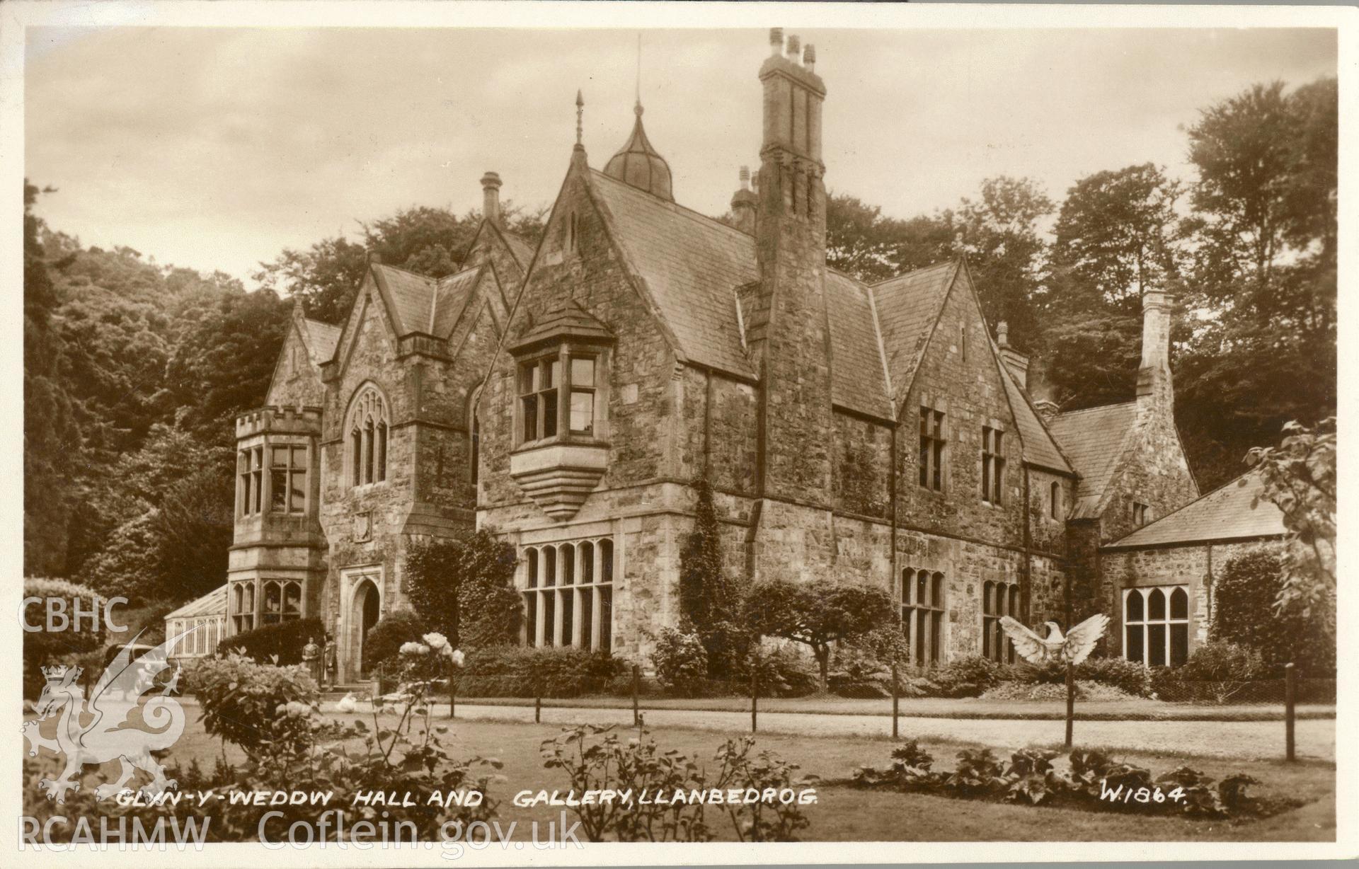 Digitised postcard image of Plas Glyn y weddw, Llanbedrog, with figures, Valentines & Sons Ltd. Produced by Parks and Gardens Data Services, from an original item in the Peter Davis Collection at Parks and Gardens UK. We hold only web-resolution images of this collection, suitable for viewing on screen and for research purposes only. We do not hold the original images, or publication quality scans.
