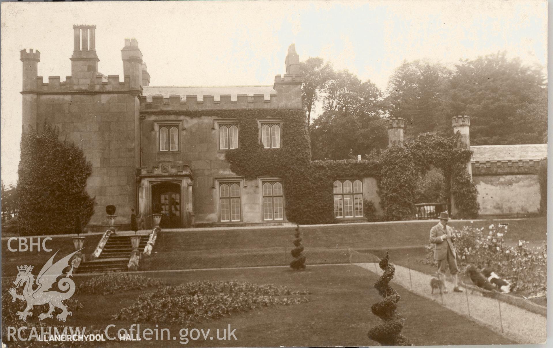 Digitised postcard image of Llanerchydol Hall, Welshpool, with figure. Produced by Parks and Gardens Data Services, from an original item in the Peter Davis Collection at Parks and Gardens UK. We hold only web-resolution images of this collection, suitable for viewing on screen and for research purposes only. We do not hold the original images, or publication quality scans.