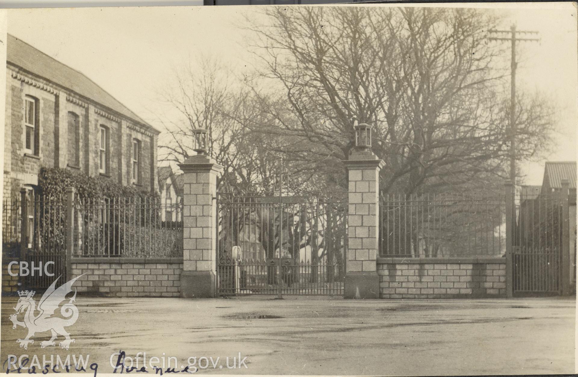 Digitised postcard image of Plascrug Avenue, Aberystwyth, including entrance gates. Produced by Parks and Gardens Data Services, from an original item in the Peter Davis Collection at Parks and Gardens UK. We hold only web-resolution images of this collection, suitable for viewing on screen and for research purposes only. We do not hold the original images, or publication quality scans.