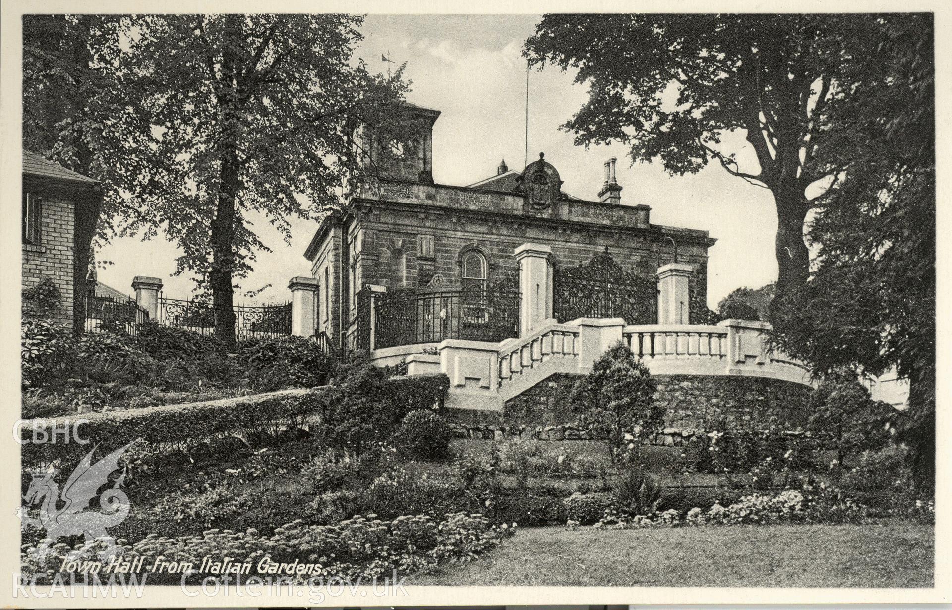 Digitised postcard image of Pontypool Town Hall, from the Italian gardens. Produced by Parks and Gardens Data Services, from an original item in the Peter Davis Collection at Parks and Gardens UK. We hold only web-resolution images of this collection, suitable for viewing on screen and for research purposes only. We do not hold the original images, or publication quality scans.
