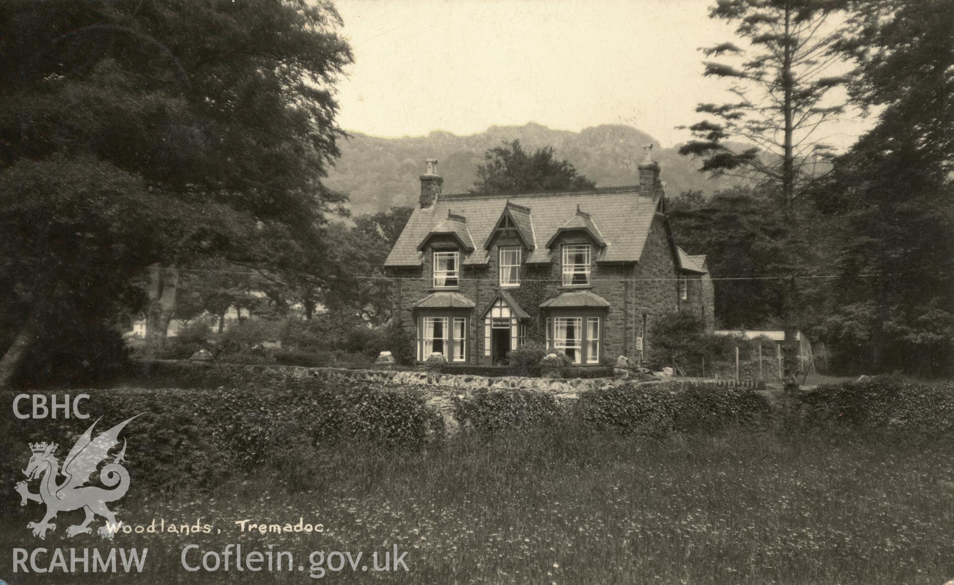 Digitised postcard image of Woodlands, Tremadog. Produced by Parks and Gardens Data Services, from an original item in the Peter Davis Collection at Parks and Gardens UK. We hold only web-resolution images of this collection, suitable for viewing on screen and for research purposes only. We do not hold the original images, or publication quality scans.